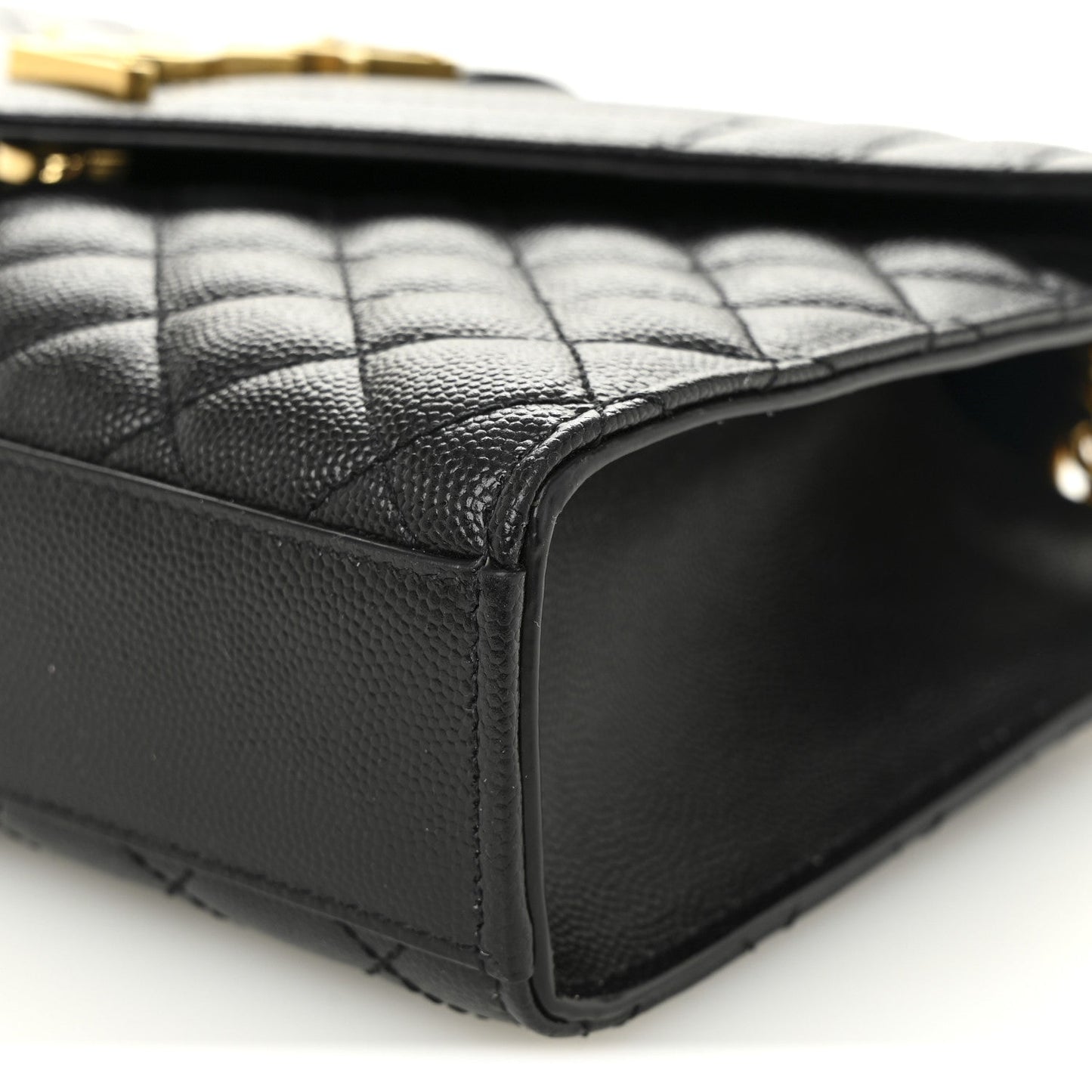 Black leather satchel corner with quilted panel and stitched edge