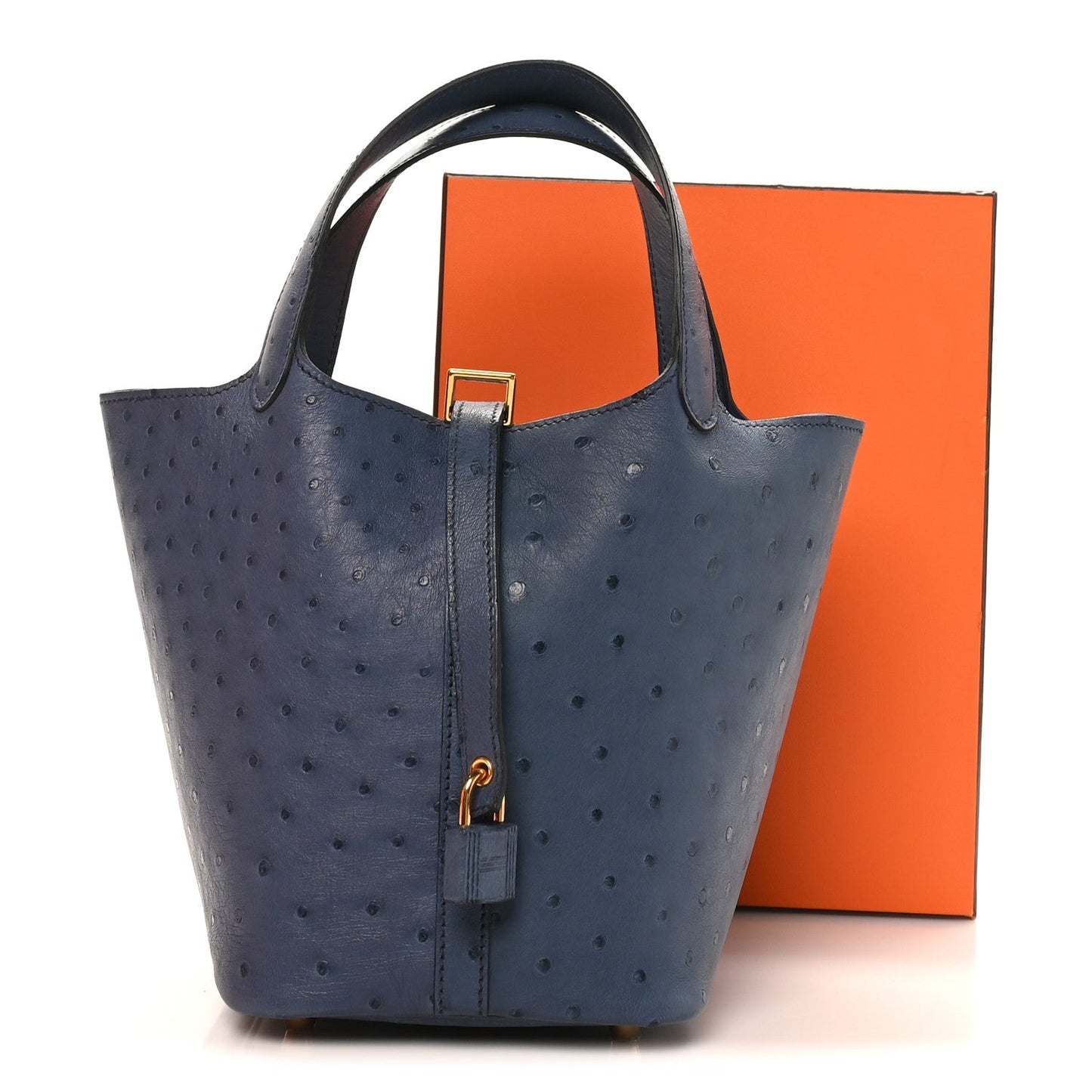Blue ostrich leather bucket bag with top handles and front strap closure, gold hardware