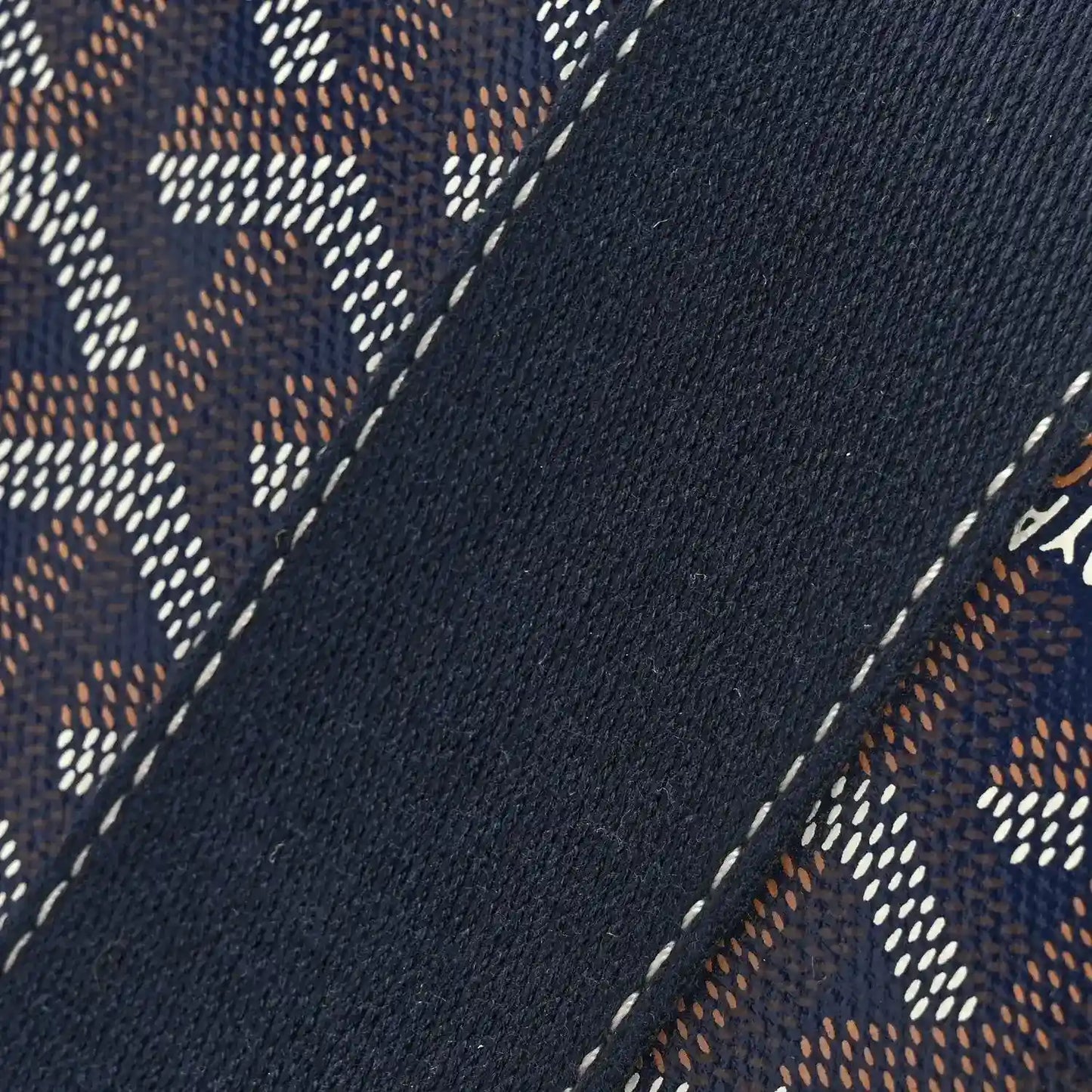 Navy patterned canvas panel with dotted motifs and white contrast stitching