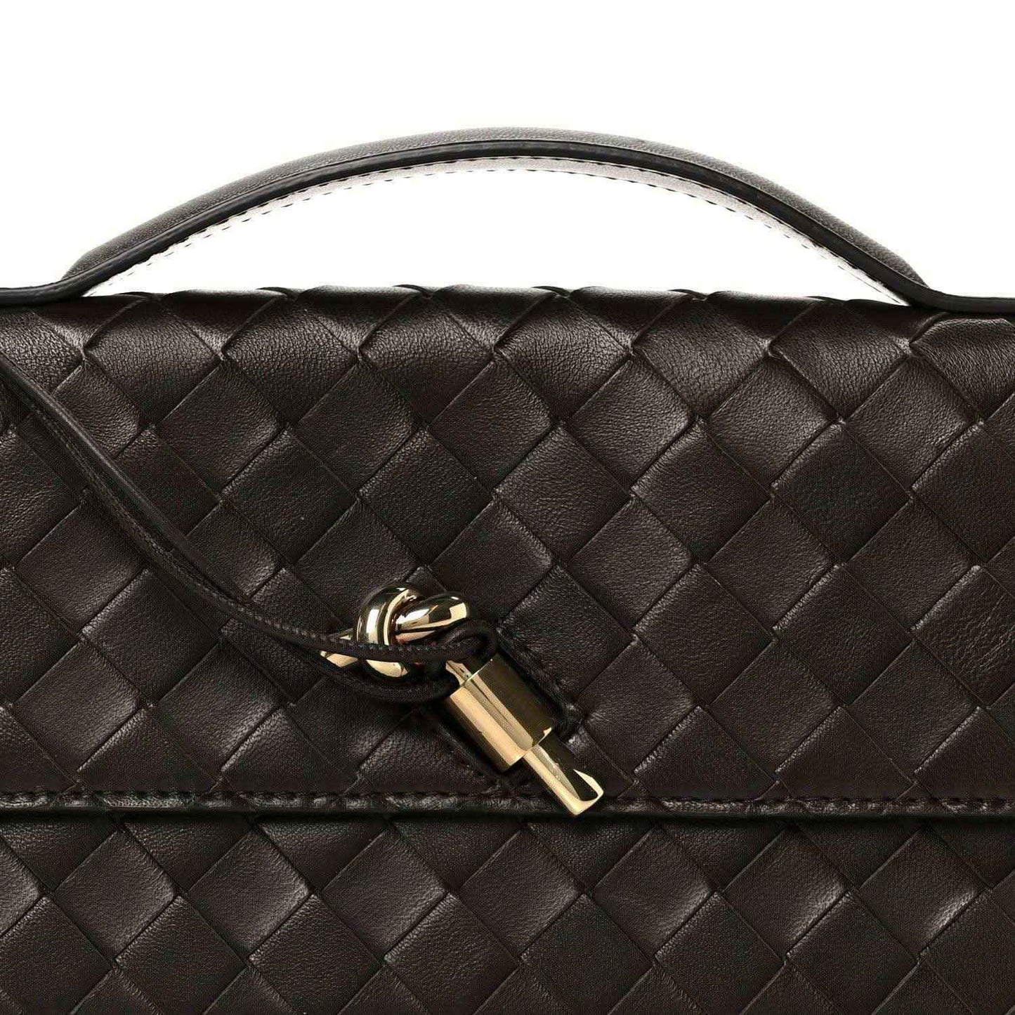 Bottega Veneta Intrecciato clutch with gold lock clasp and woven leather texture
