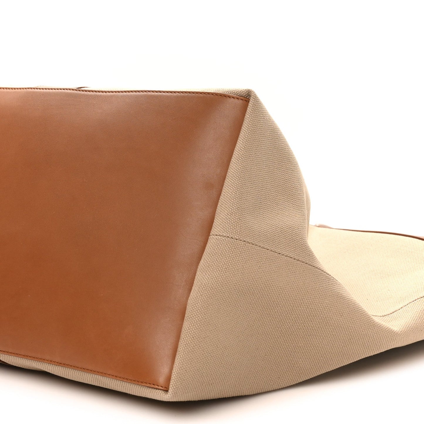 Leather corner and canvas base of Saint Laurent Y tote, brick and desert dust
