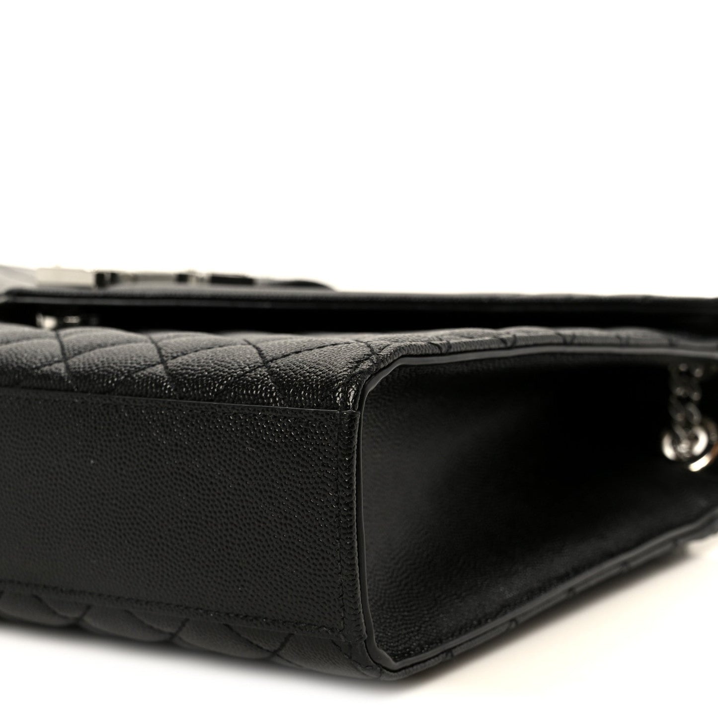 Black quilted leather satchel with structured corner and zipper trim