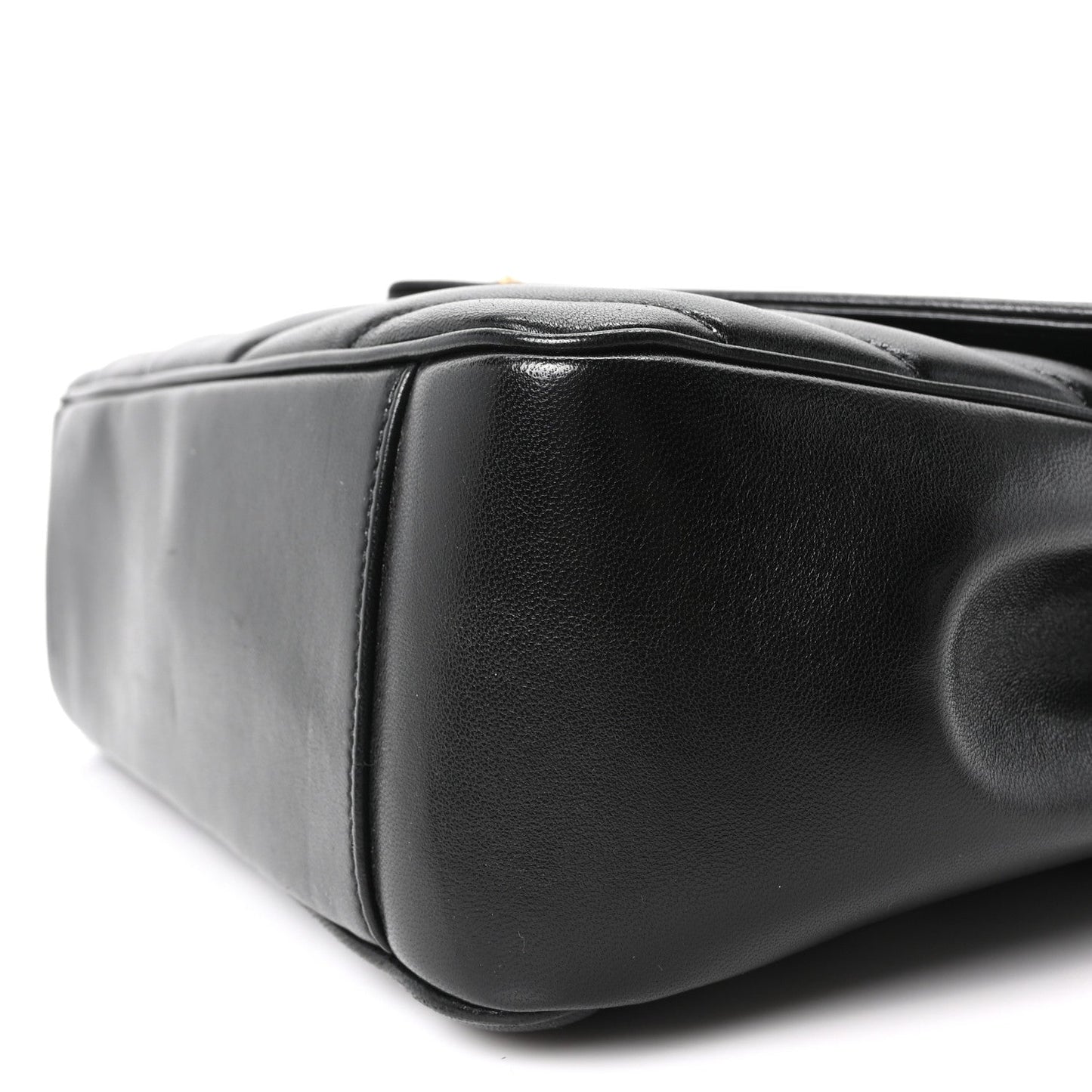 Black quilted lambskin shoulder bag with rounded corners and stitched seams