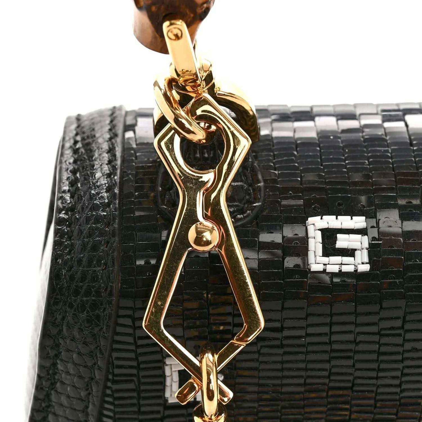 Gucci mini top handle bag with black lizard-embossed texture and gold bamboo clasp