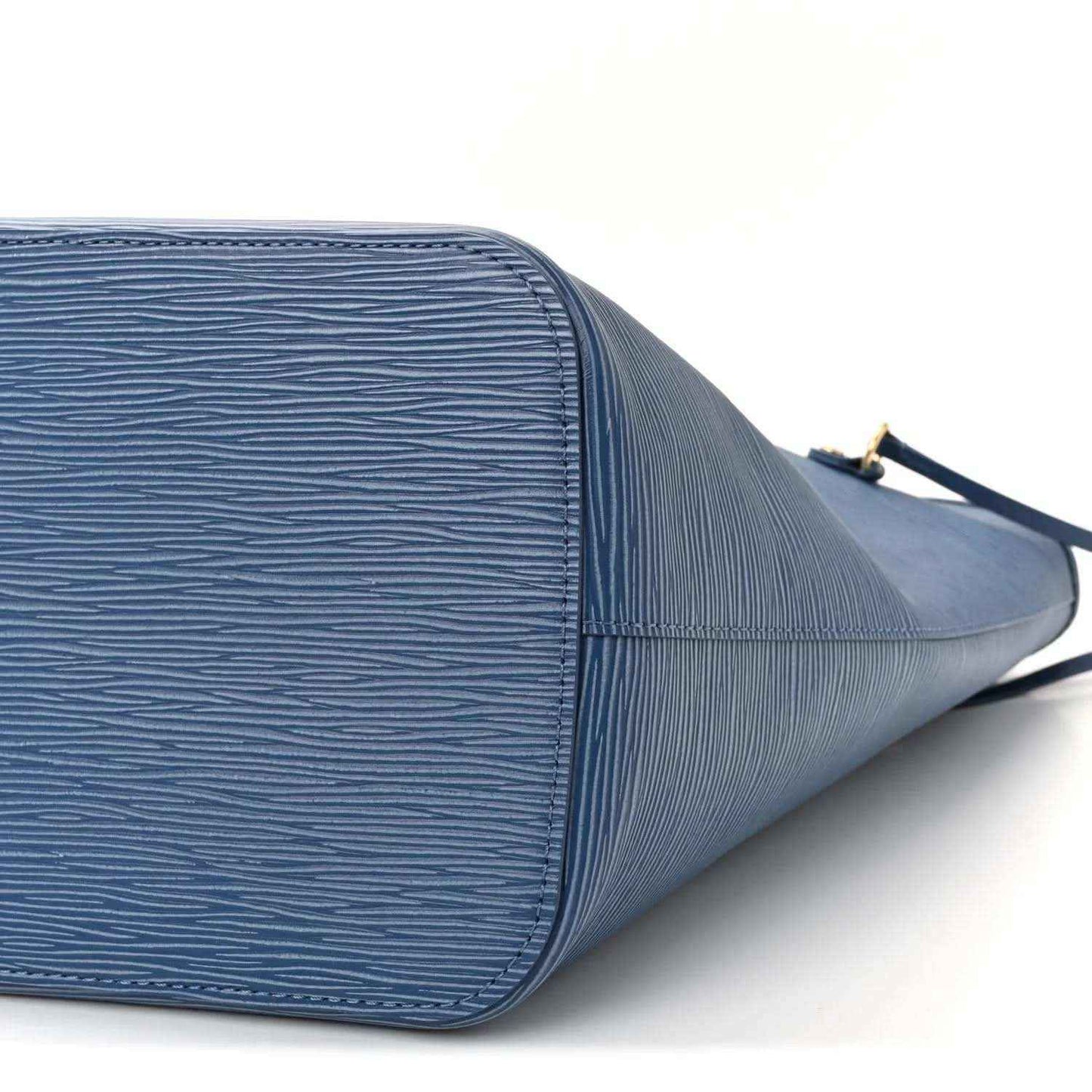 Denim blue leather tote bag close-up of side panel and stitched edges