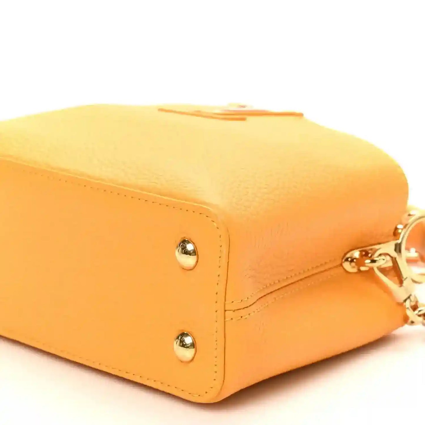 Mini Capucines handbag in yellow textured leather with corner stud detail and stitched edge