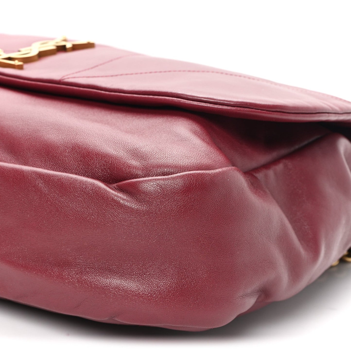 Dark bordeaux lambskin shoulder bag underside with curved seam and chain attachment