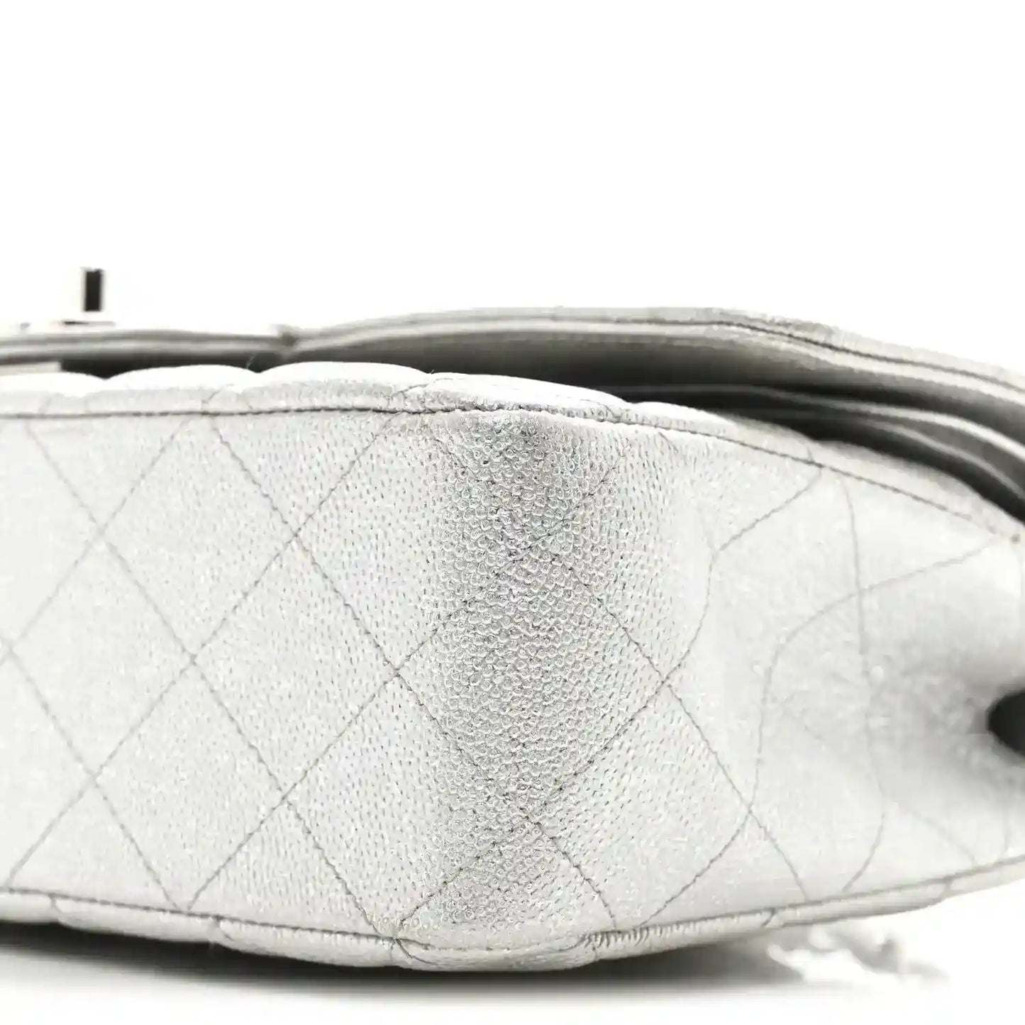 Chanel silver metallic double flap bag underside edge close-up with quilting seams