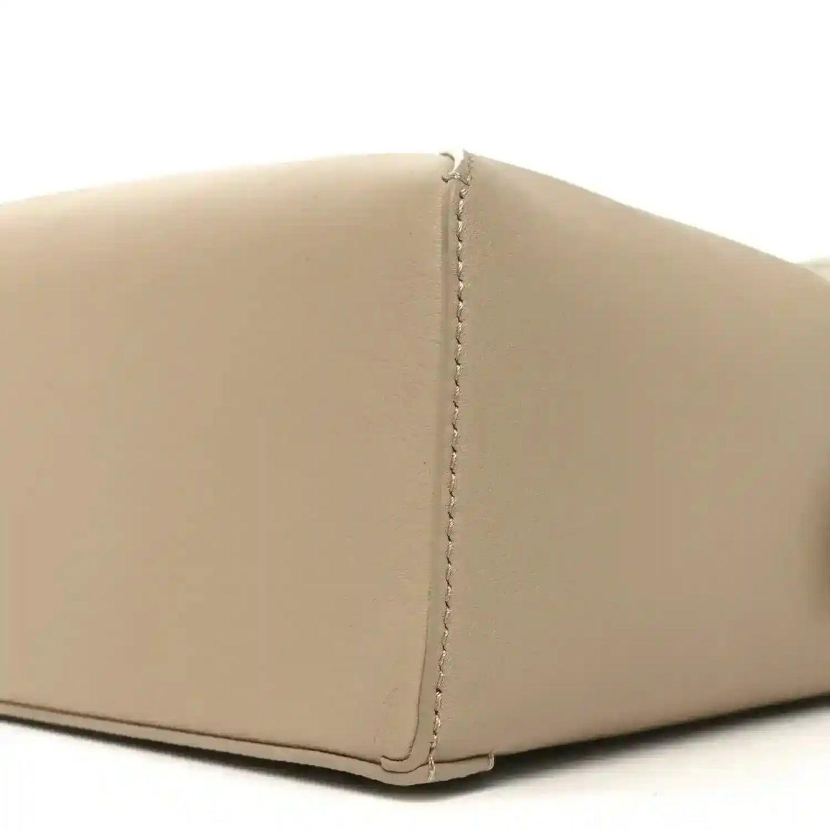 Small Puzzle edge bag side seam detail, soft white calfskin with vertical stitching