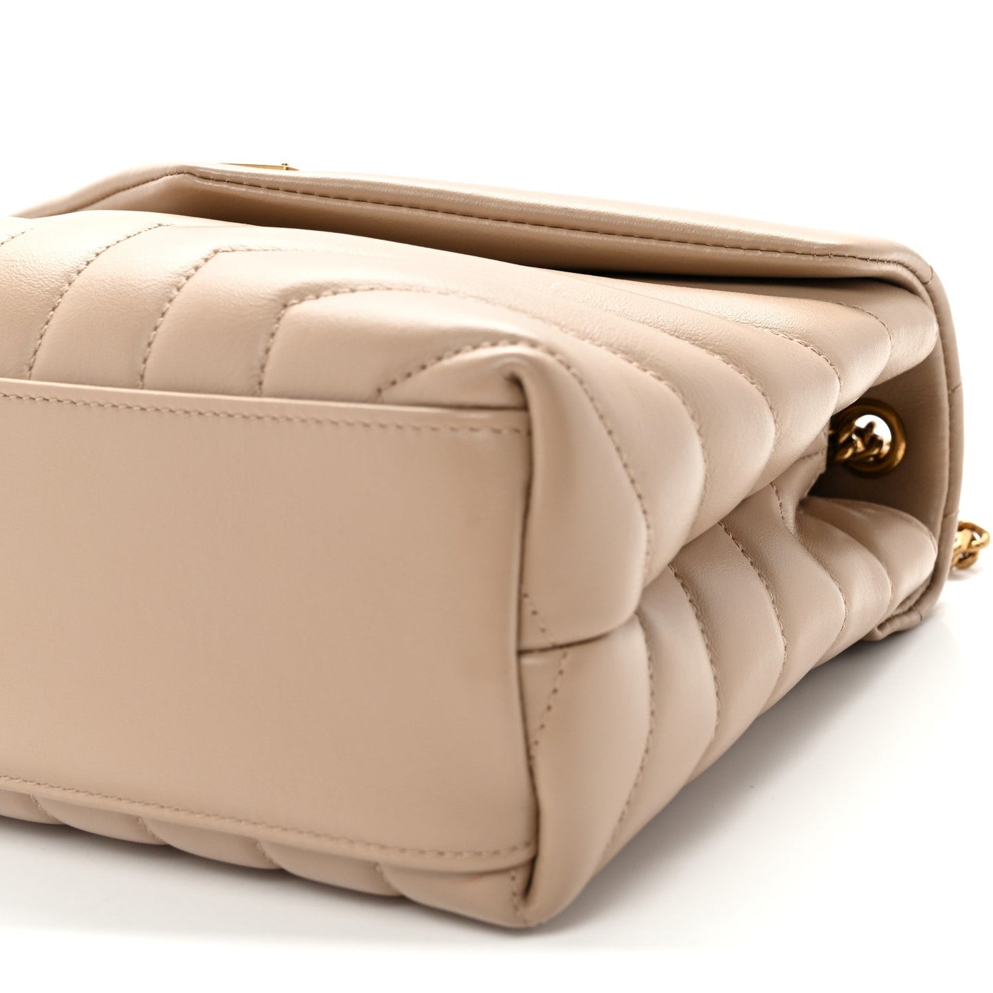 Quilted dark beige satchel side with snap button and gold hardware