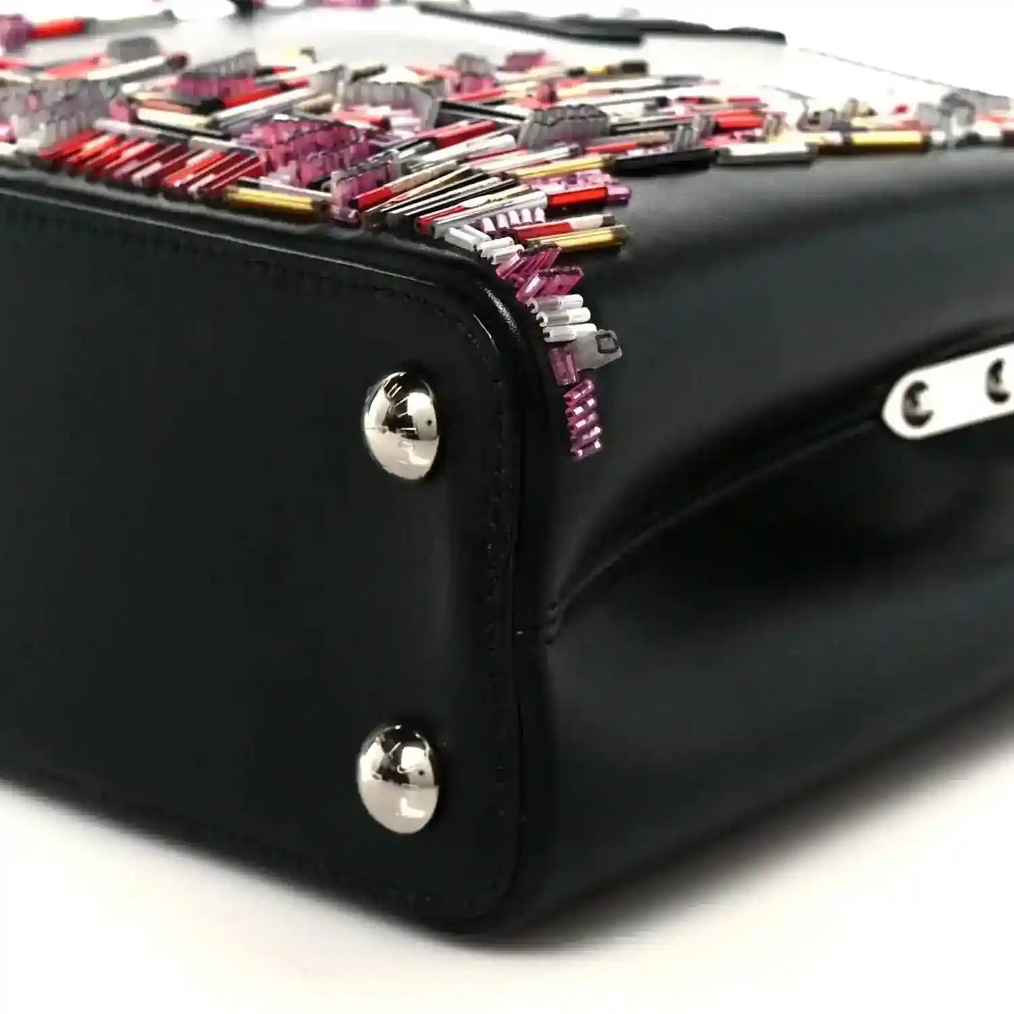 Capucines BB black bag corner with silver knobs and colorful beaded skyline top