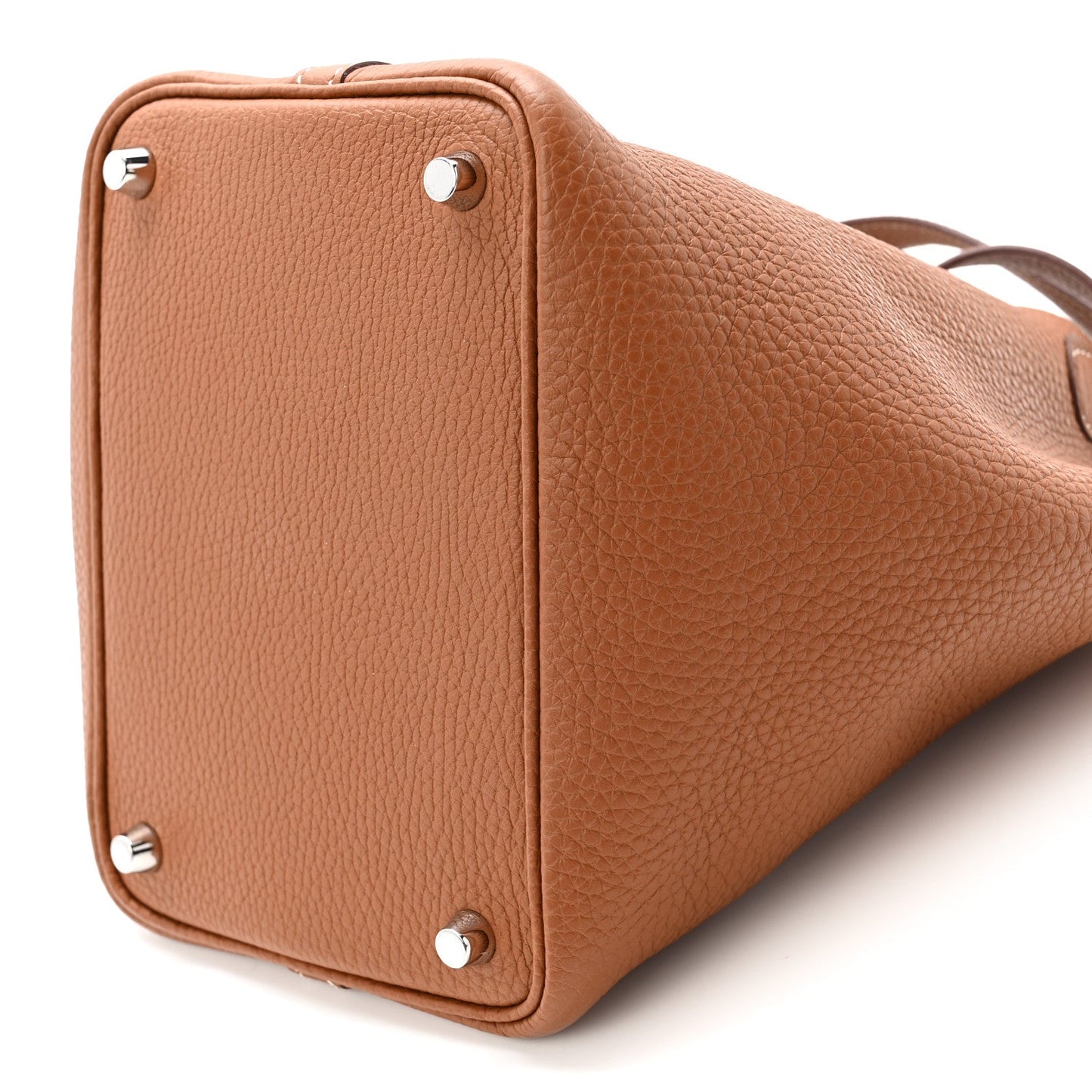 Cognac brown leather tote bag with squared sides, studs, and short top handles