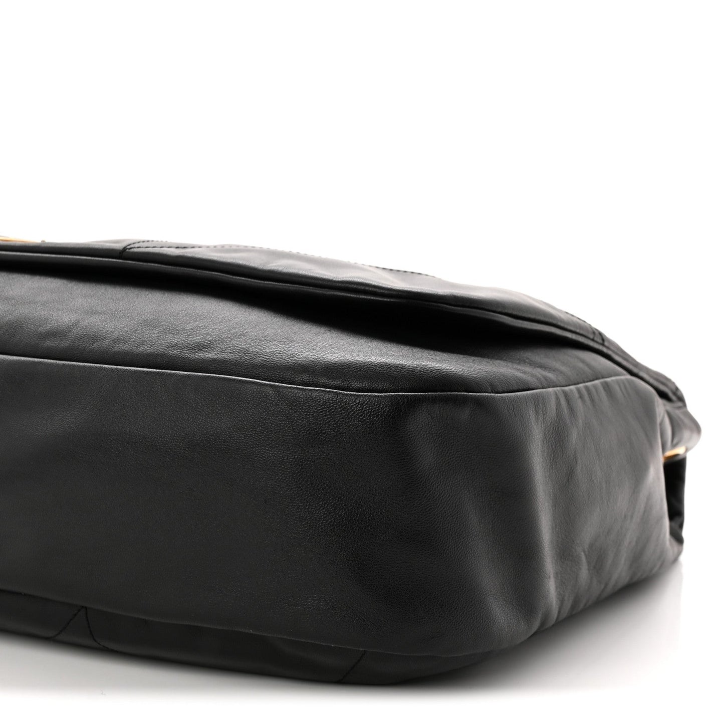 Black quilted lambskin shoulder bag close-up of side seam and bottom corner