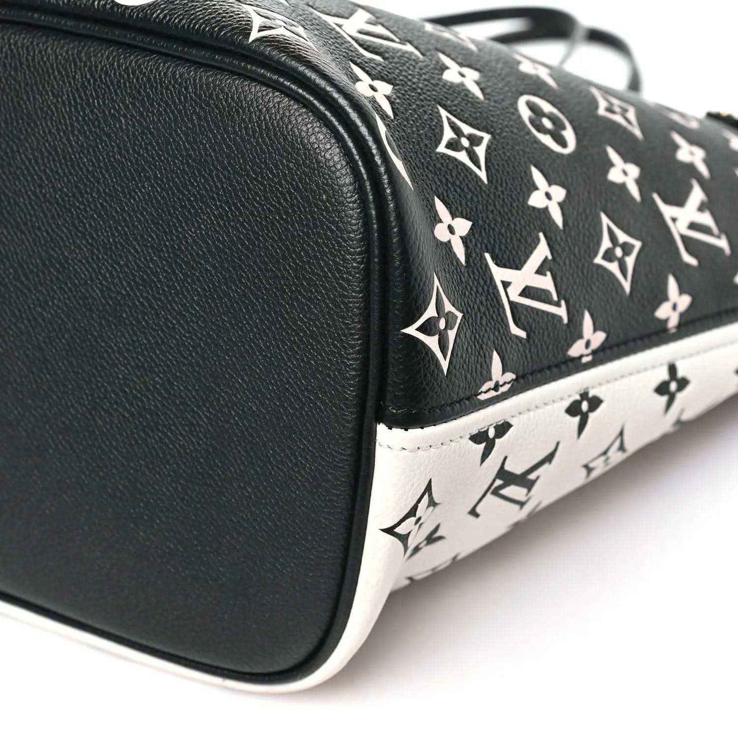 Neverfull MM pouch corner with black leather trim and black-and-white monogram canvas