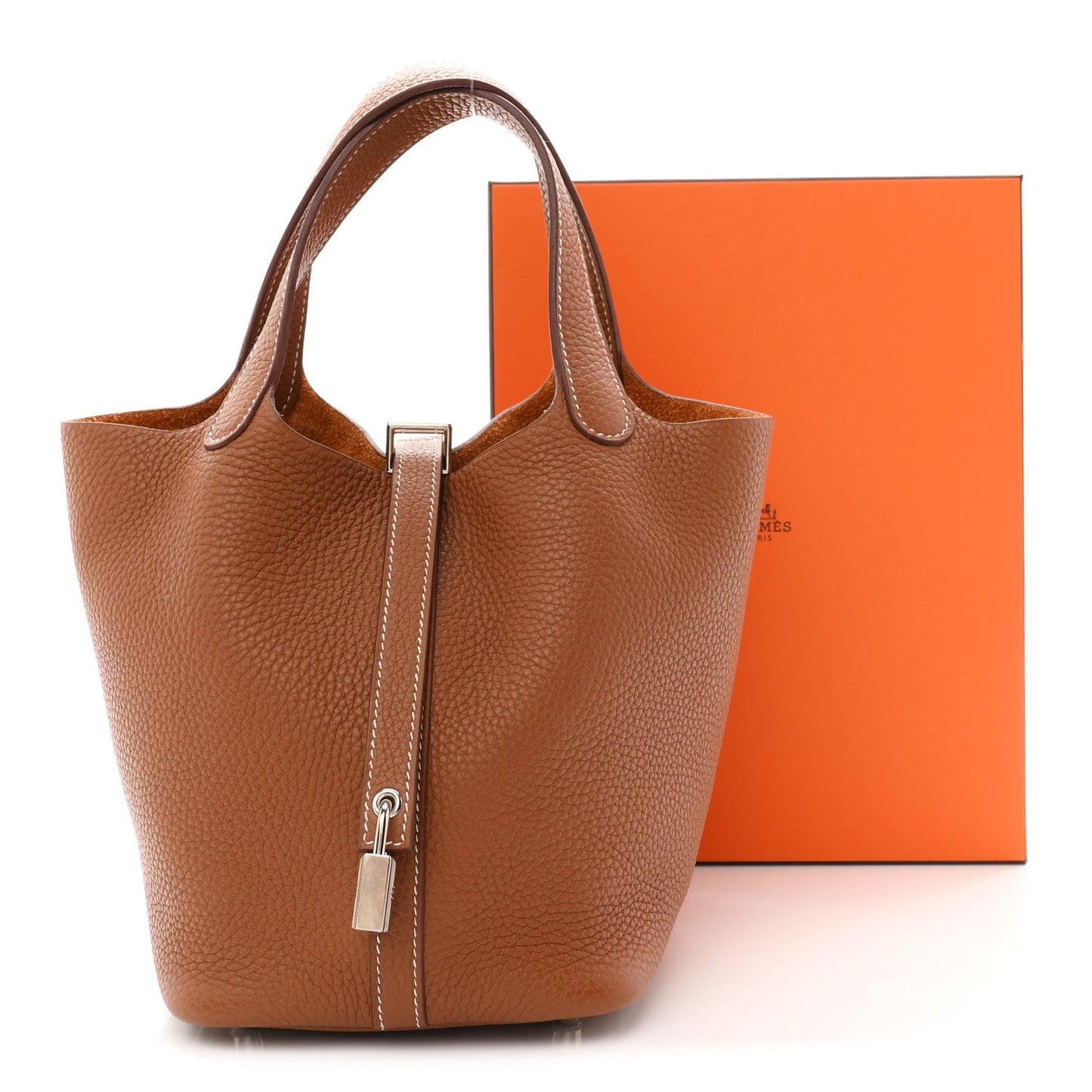 Brown leather bucket tote bag with top handles and vertical zip closure