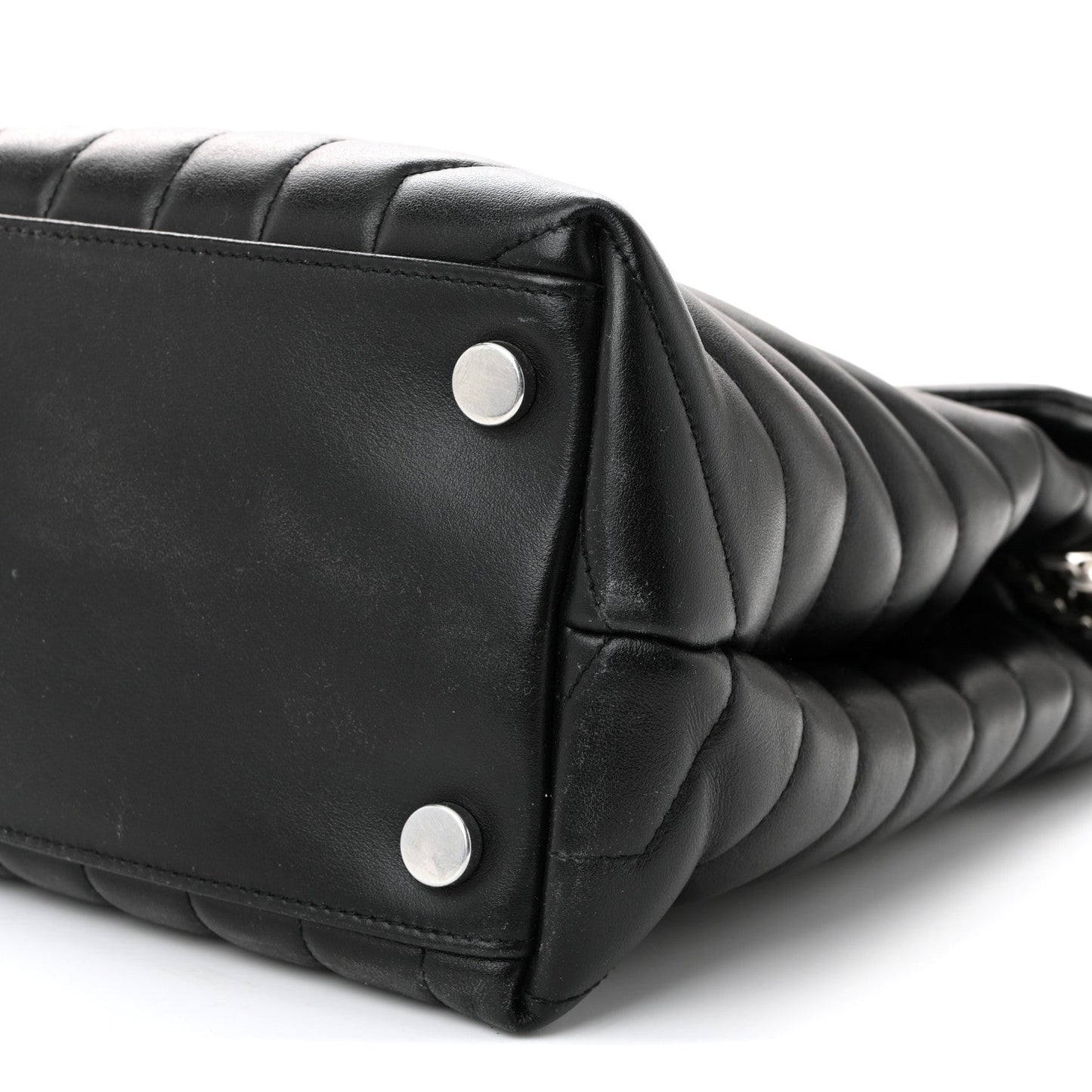 Black quilted leather satchel end with two silver rivets and chain