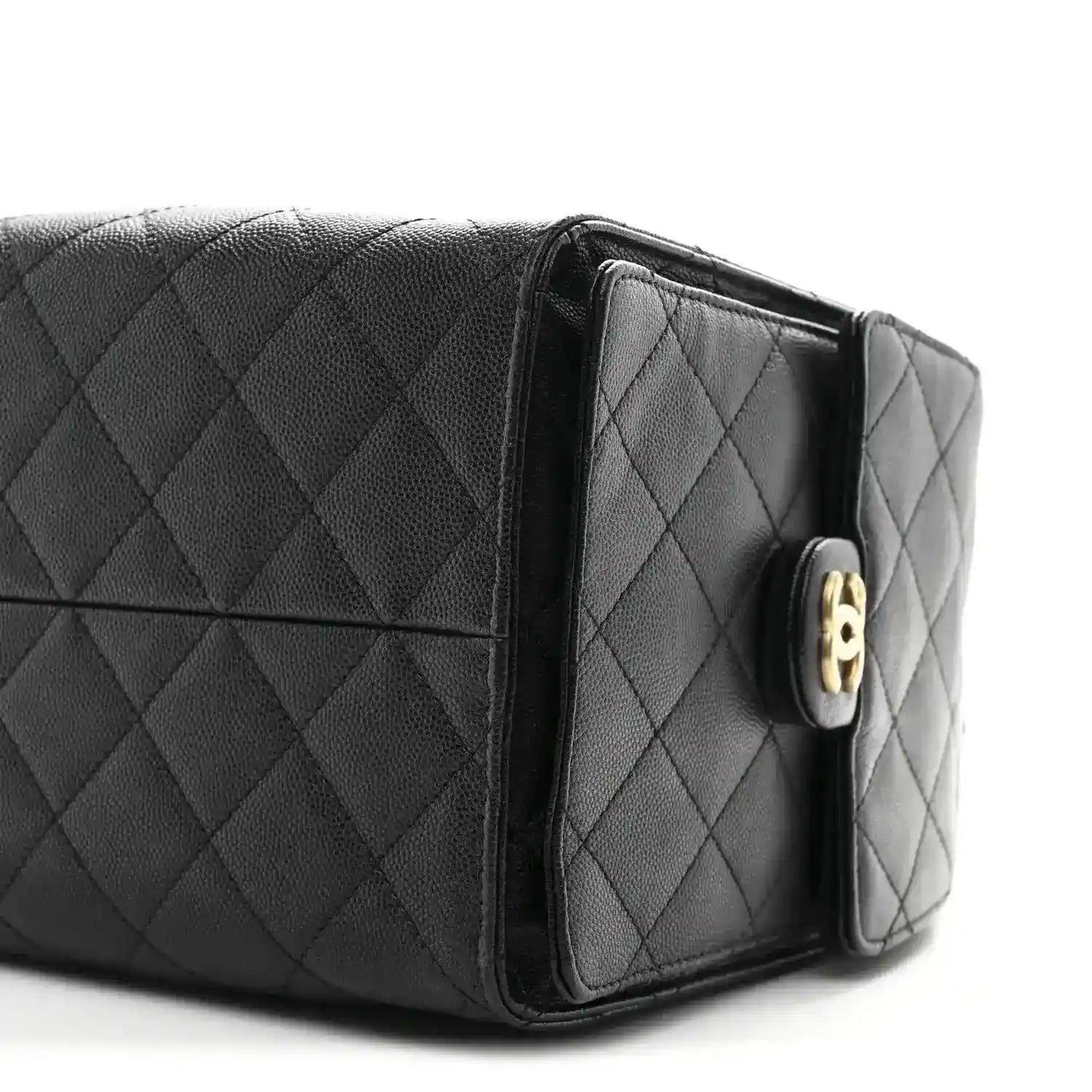 Black quilted caviar flap handbag with gold-tone turn-lock on front