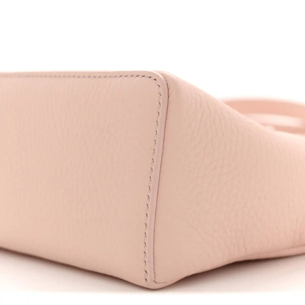 Light pink grained leather base corner with stitched seam