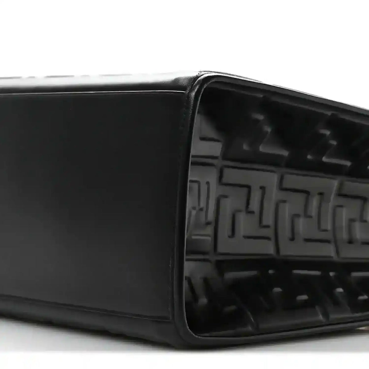Black leather tote bag open top showing embossed FF pattern inside
