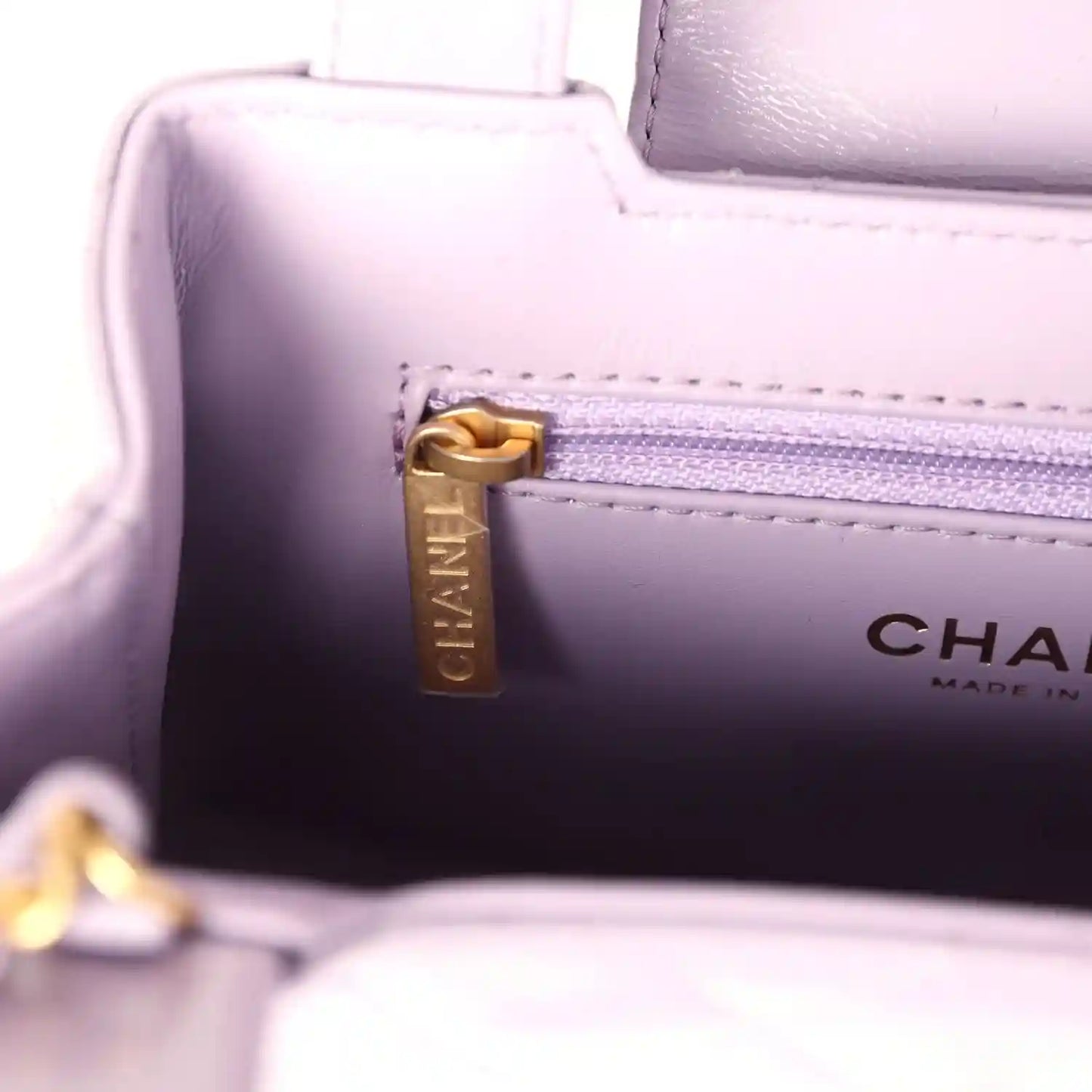 Chanel small Kelly bag interior zip pocket with CHANEL print and gold pull