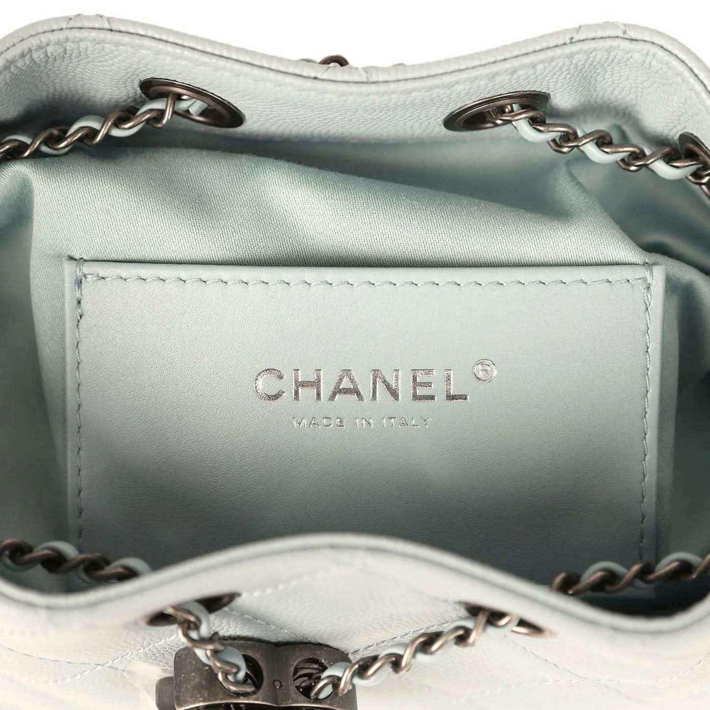 Light blue interior lining with CHANEL logo and stitched pocket opening