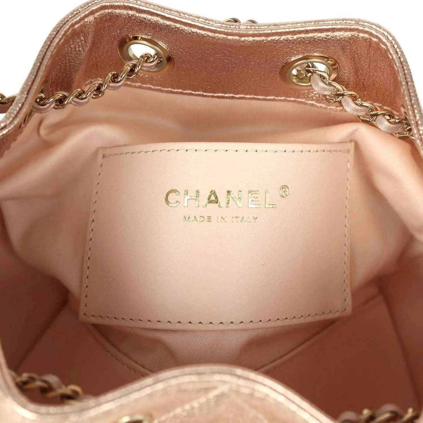 Chanel mini hobo bag interior label reading CHANEL, made in Italy, on light lining