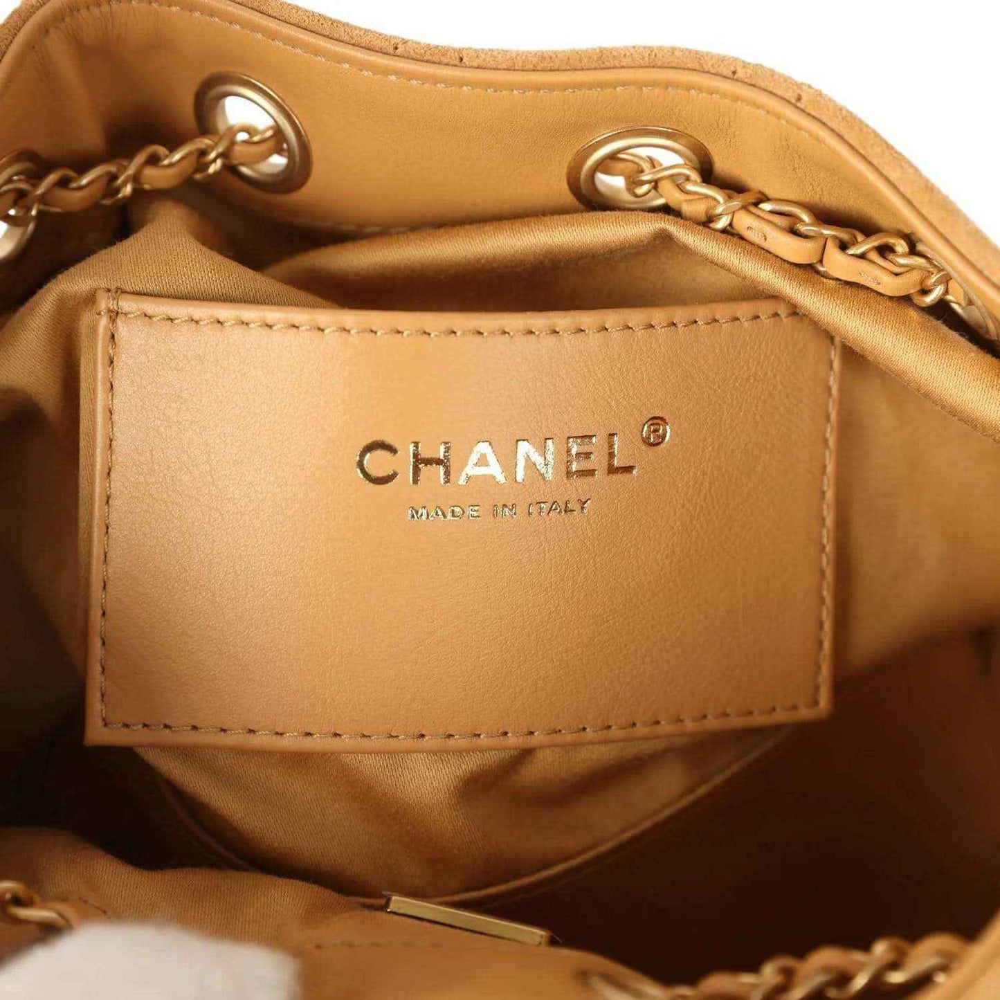 Chanel interior patch reading CHANEL and MADE IN ITALY on tan lining