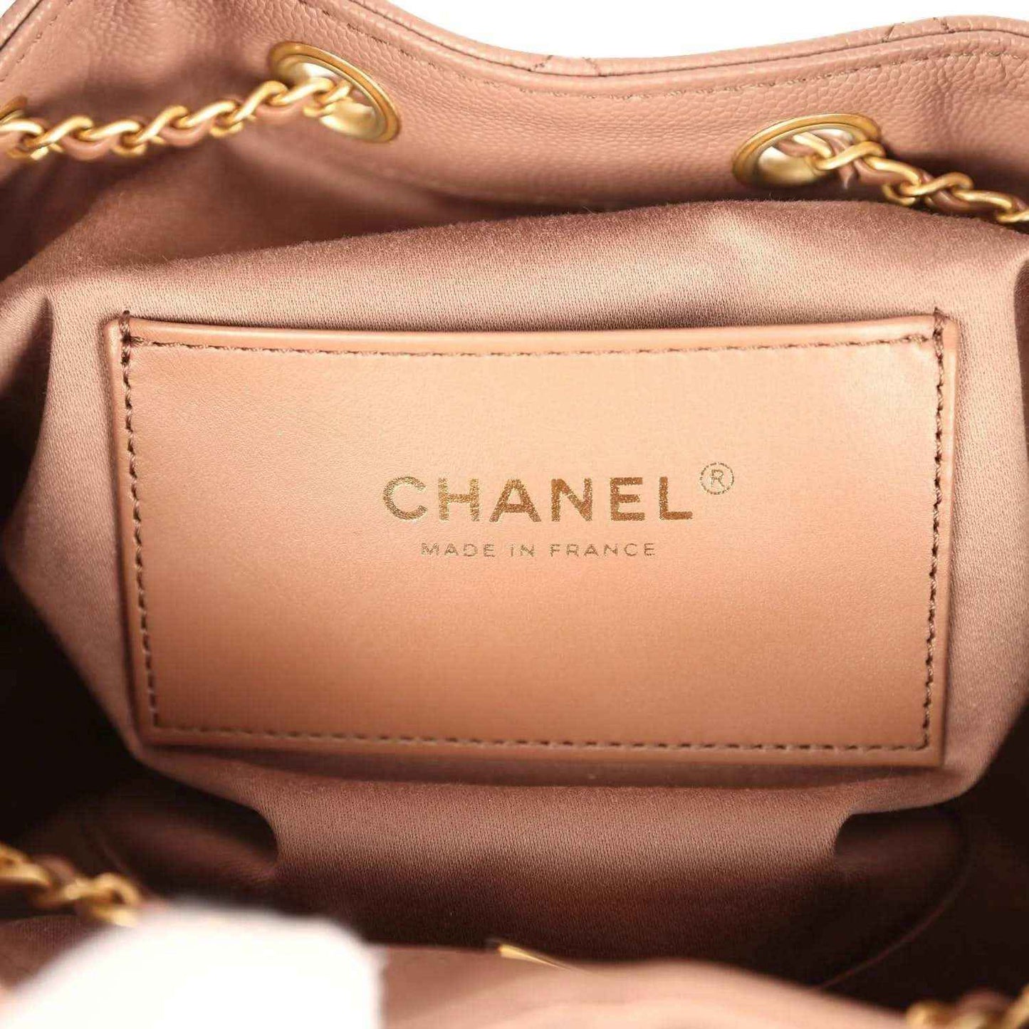 Chanel interior label with CHANEL and MADE IN FRANCE on brown lining