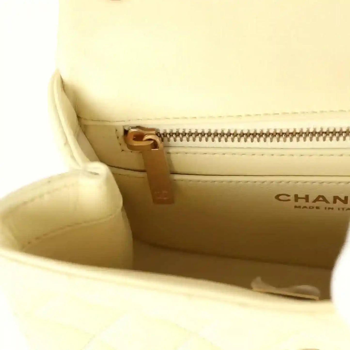 Mini square flap bag interior, yellow lambskin with gold-tone zipper and Chanel stamp