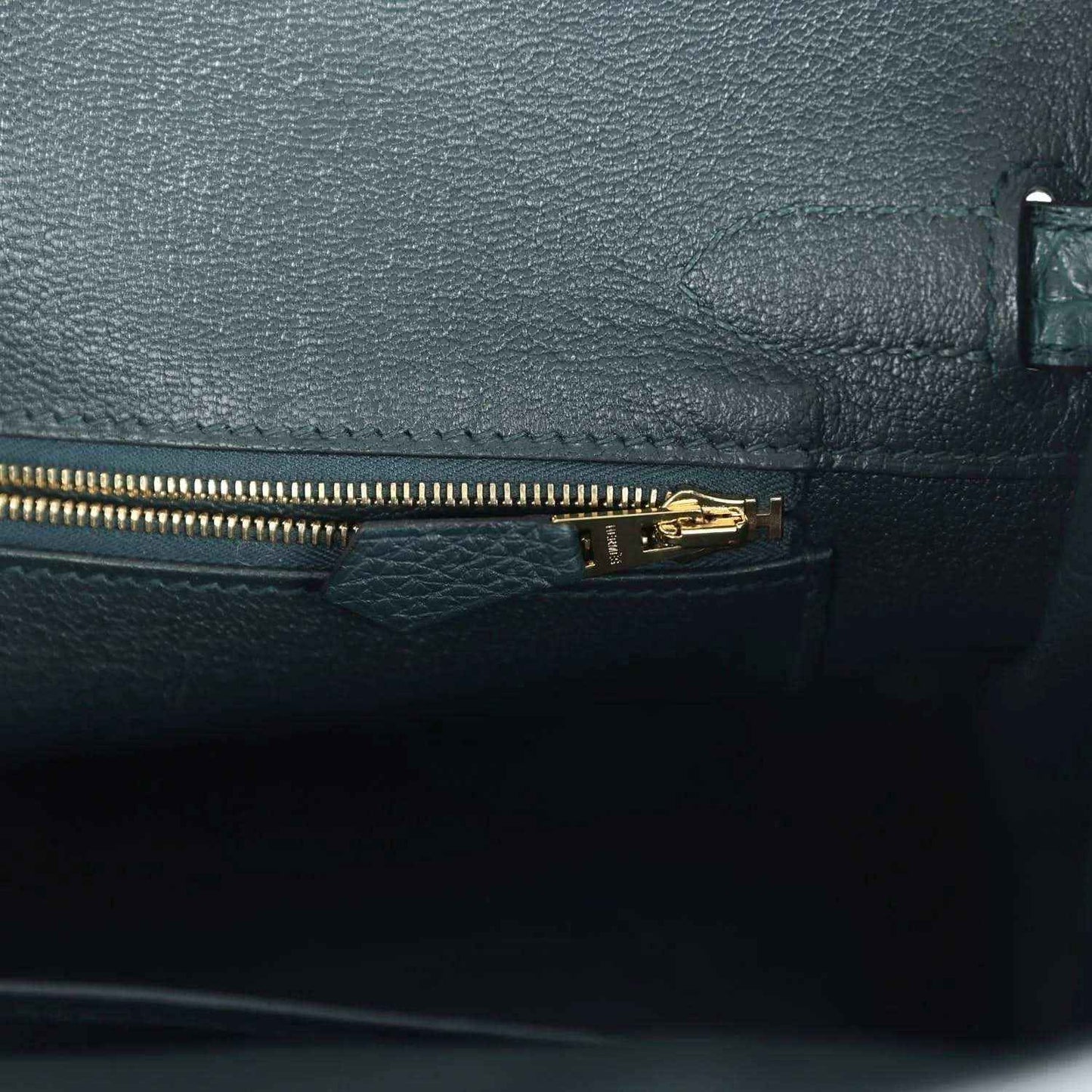 Birkin handbag interior zipper pocket in dark green leather with gold zipper pull