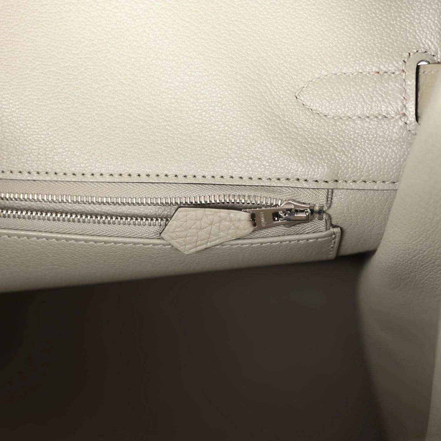 Sauge leather handbag with interior zip pocket and metal zipper pull