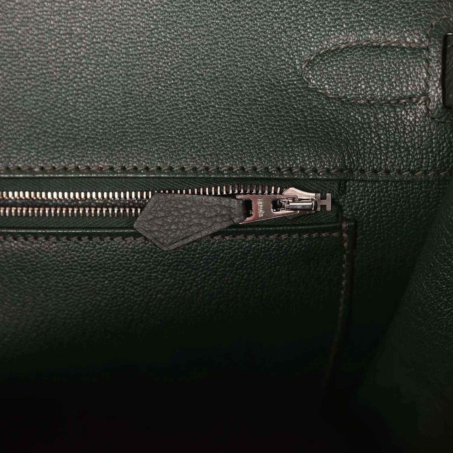 Dark green Togo leather handbag with front zipper and silver-tone pull hardware