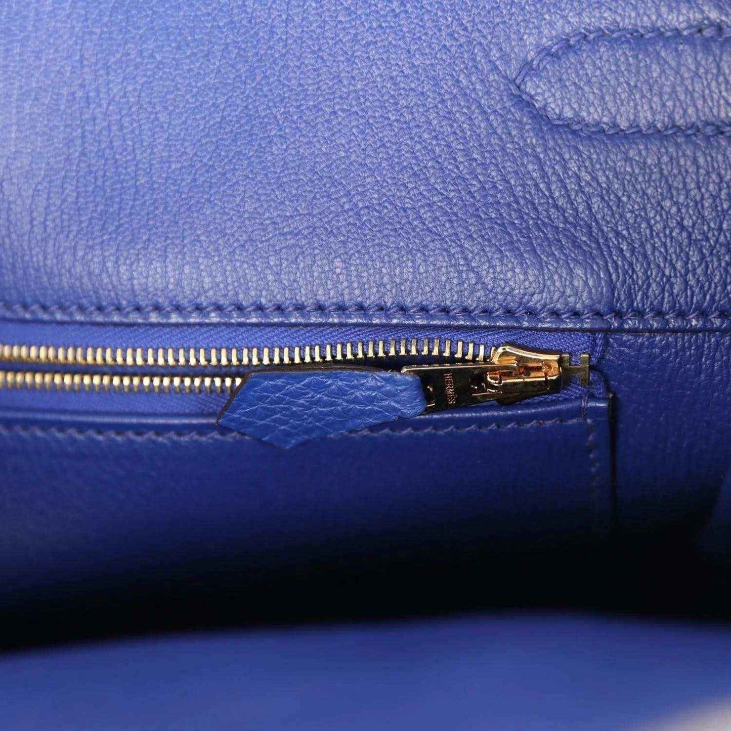 Hermes Birkin handbag interior zipper pocket with gold pull and blue lining