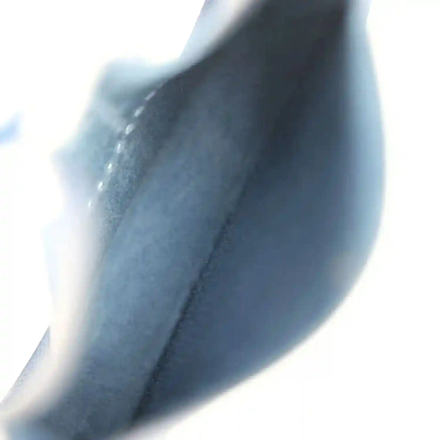 Blue leather bag interior lining close-up with seam and edge