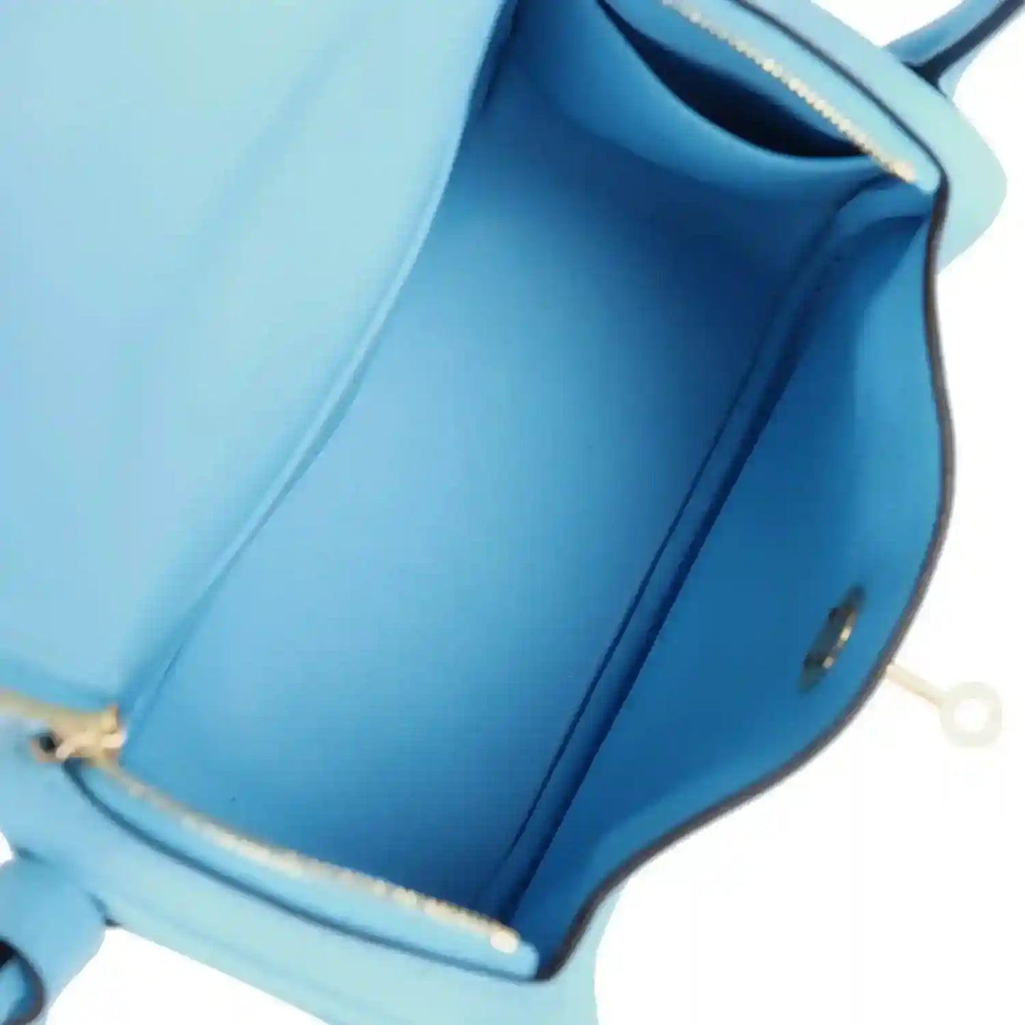 Mini handbag interior lining with side seam and gold-trimmed opening edge