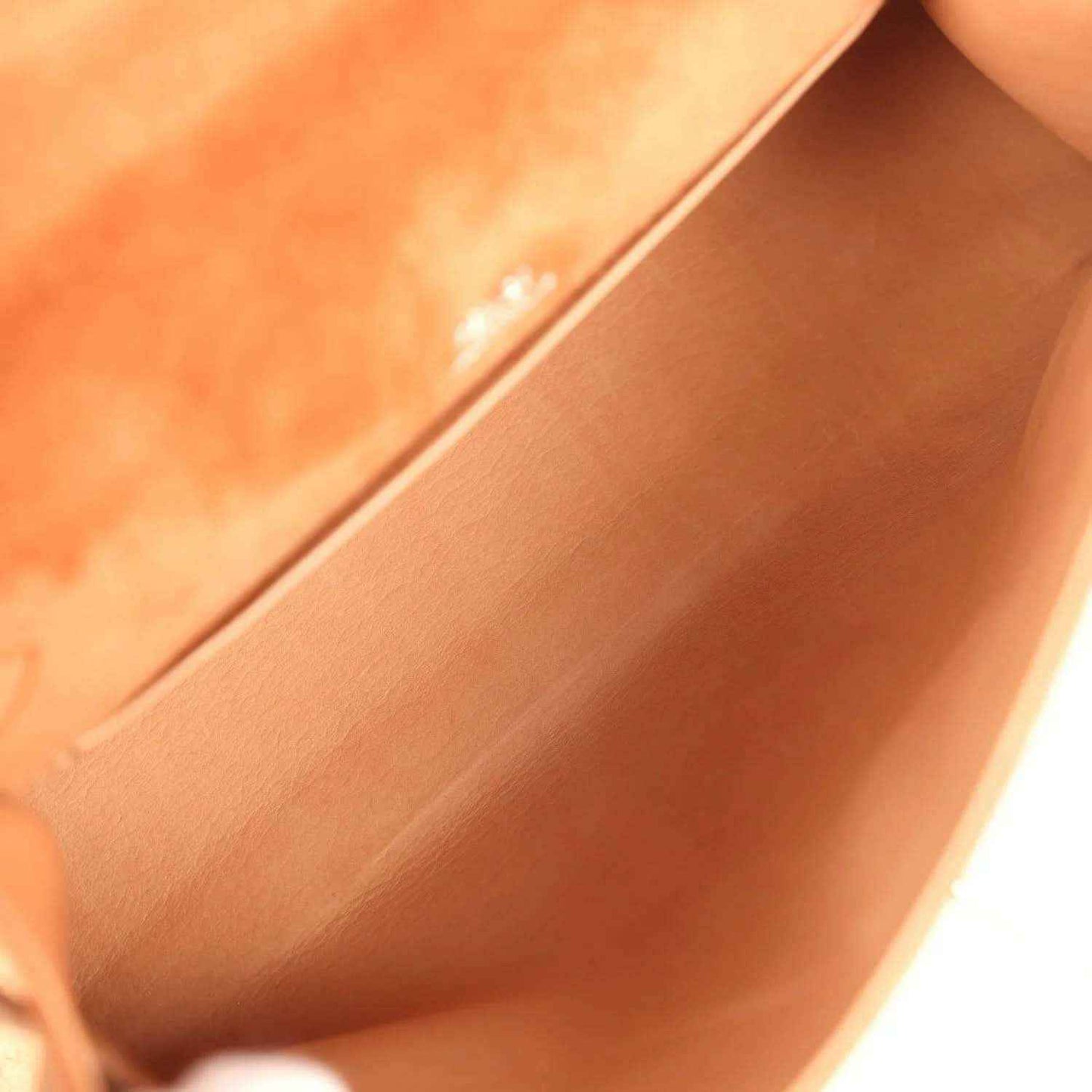 Suede interior of Hermès Kelly-style pochette with seam and lining, fauve