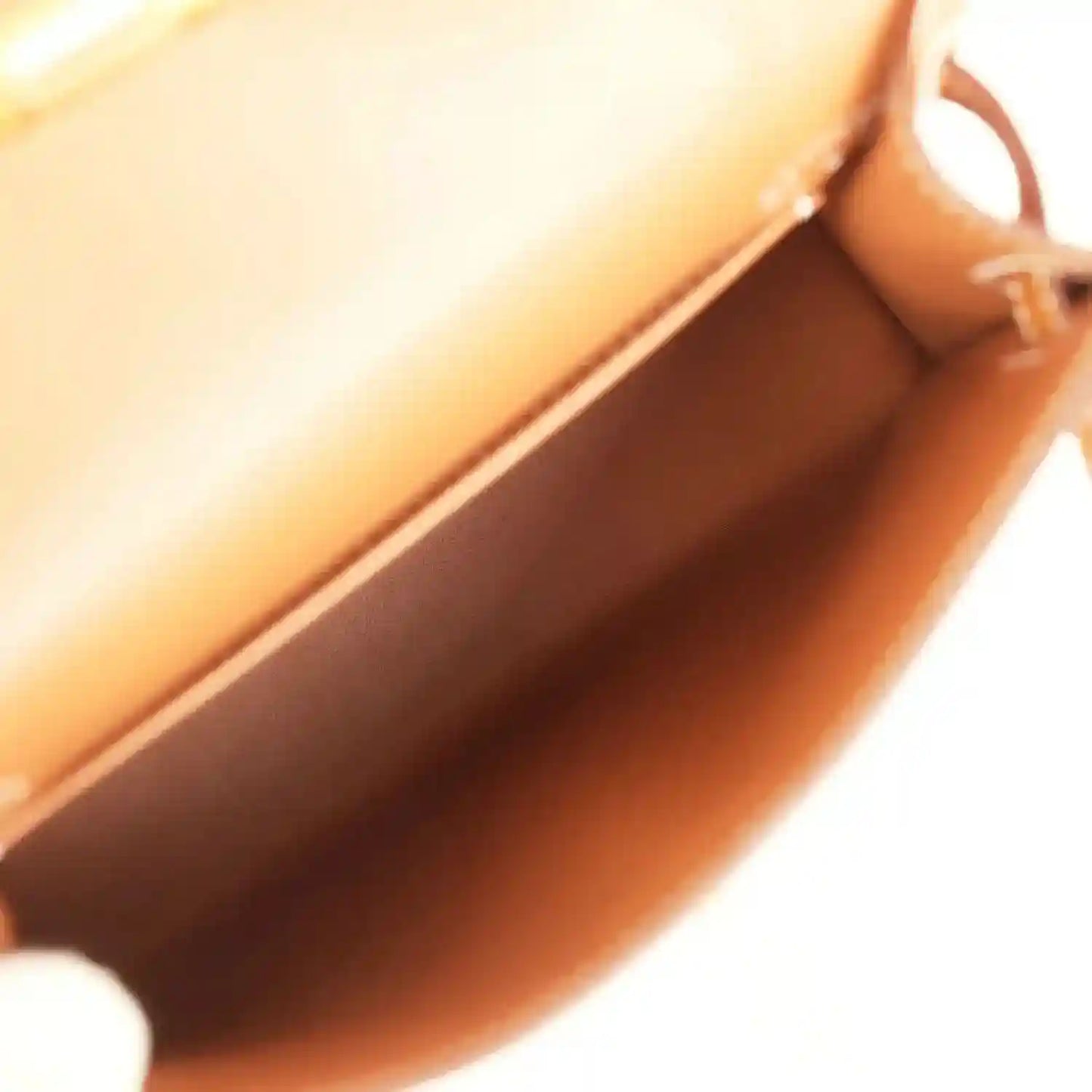 Tan leather mini handbag interior near the opening