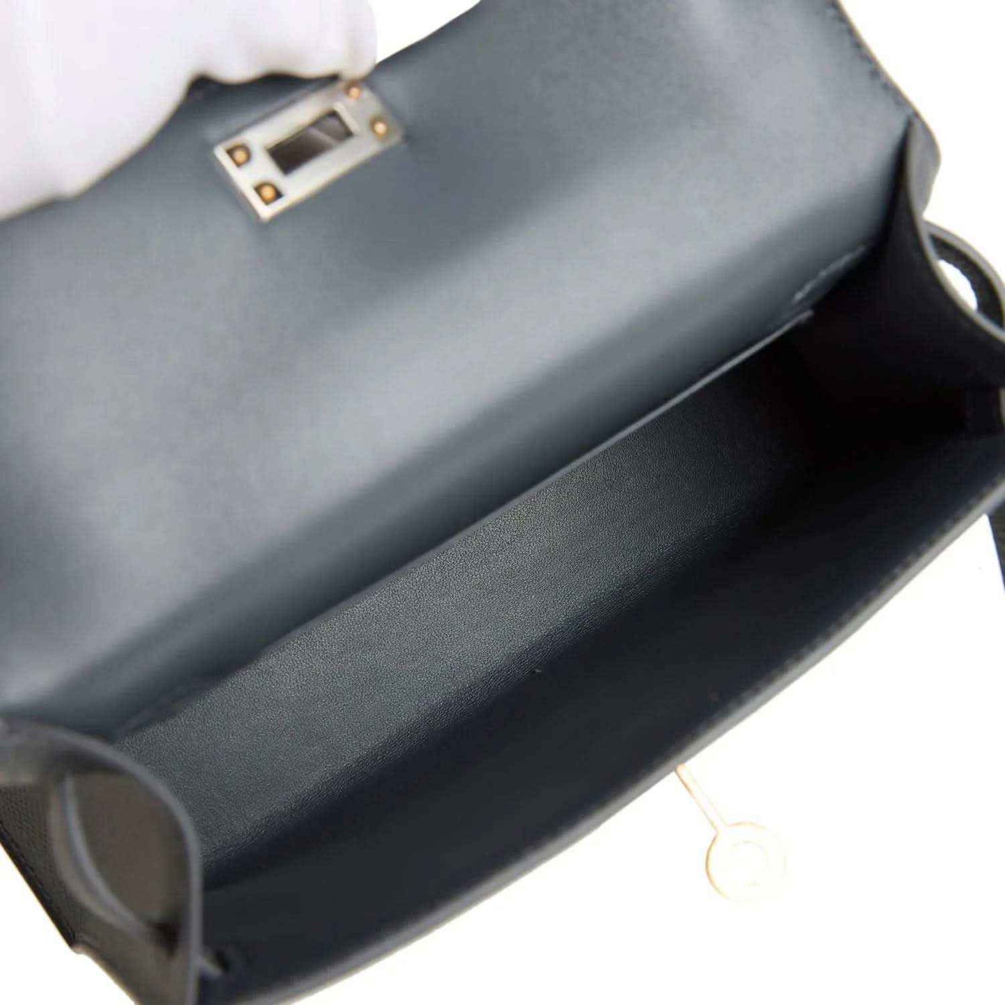 Hermes Kelly Sellier 20 bag interior view with dark gray-blue lining and clasp edge