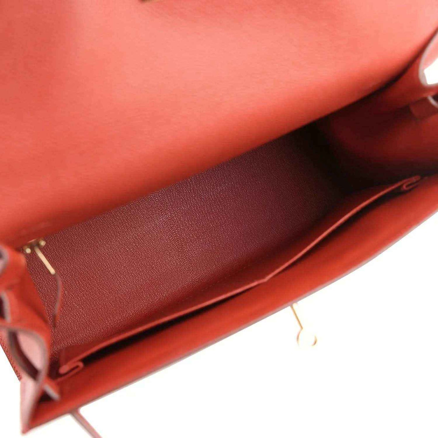 Red Kelly handbag interior with smooth lining and leather trim