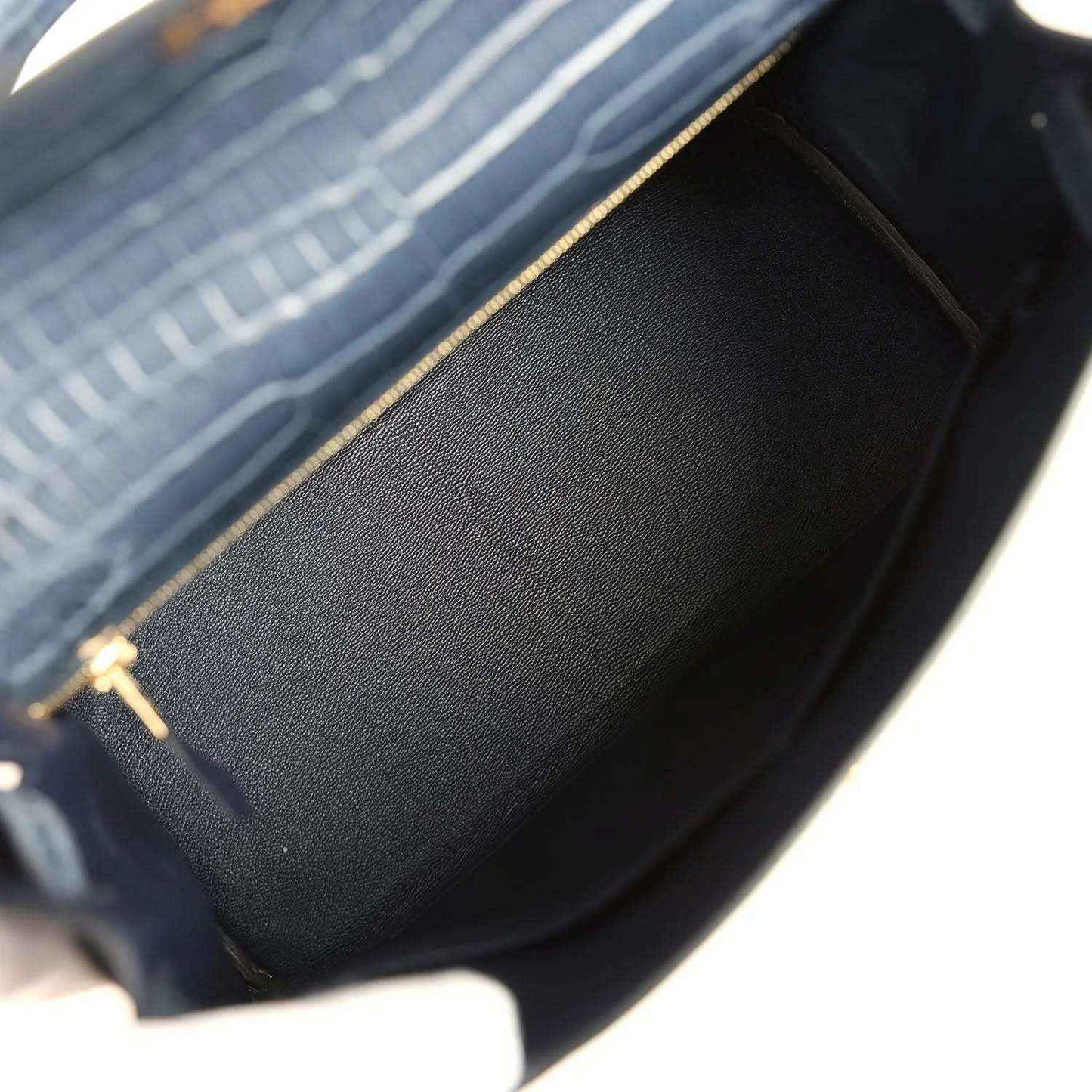 Hermès Kelly Retourne 28 bag interior close-up with structured lining and gold zipper