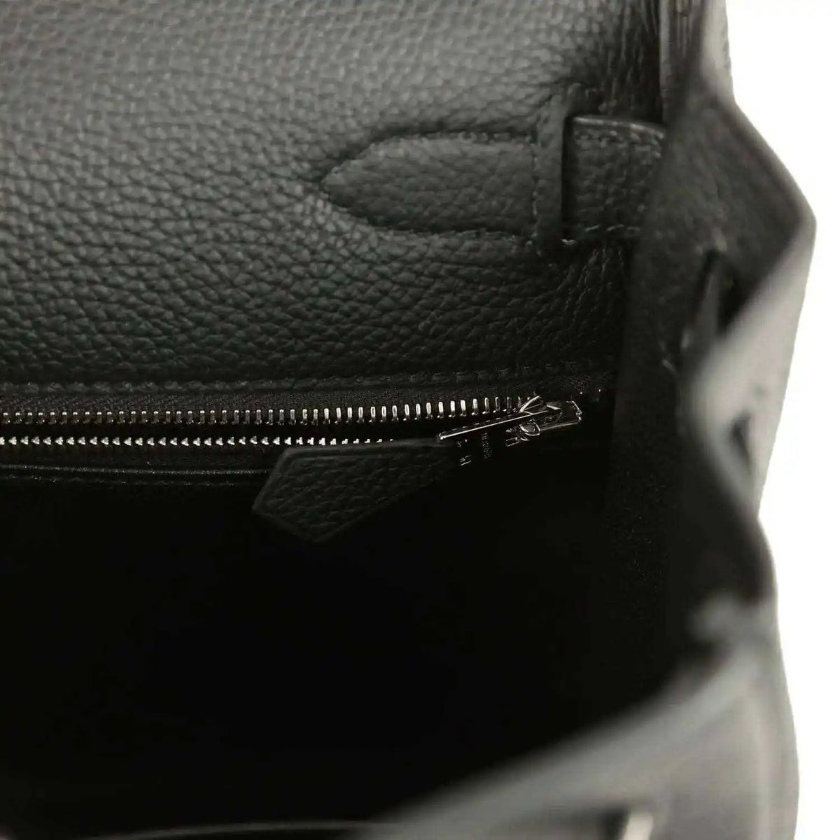 Black leather Kelly bag interior with zipper closure and metal pull