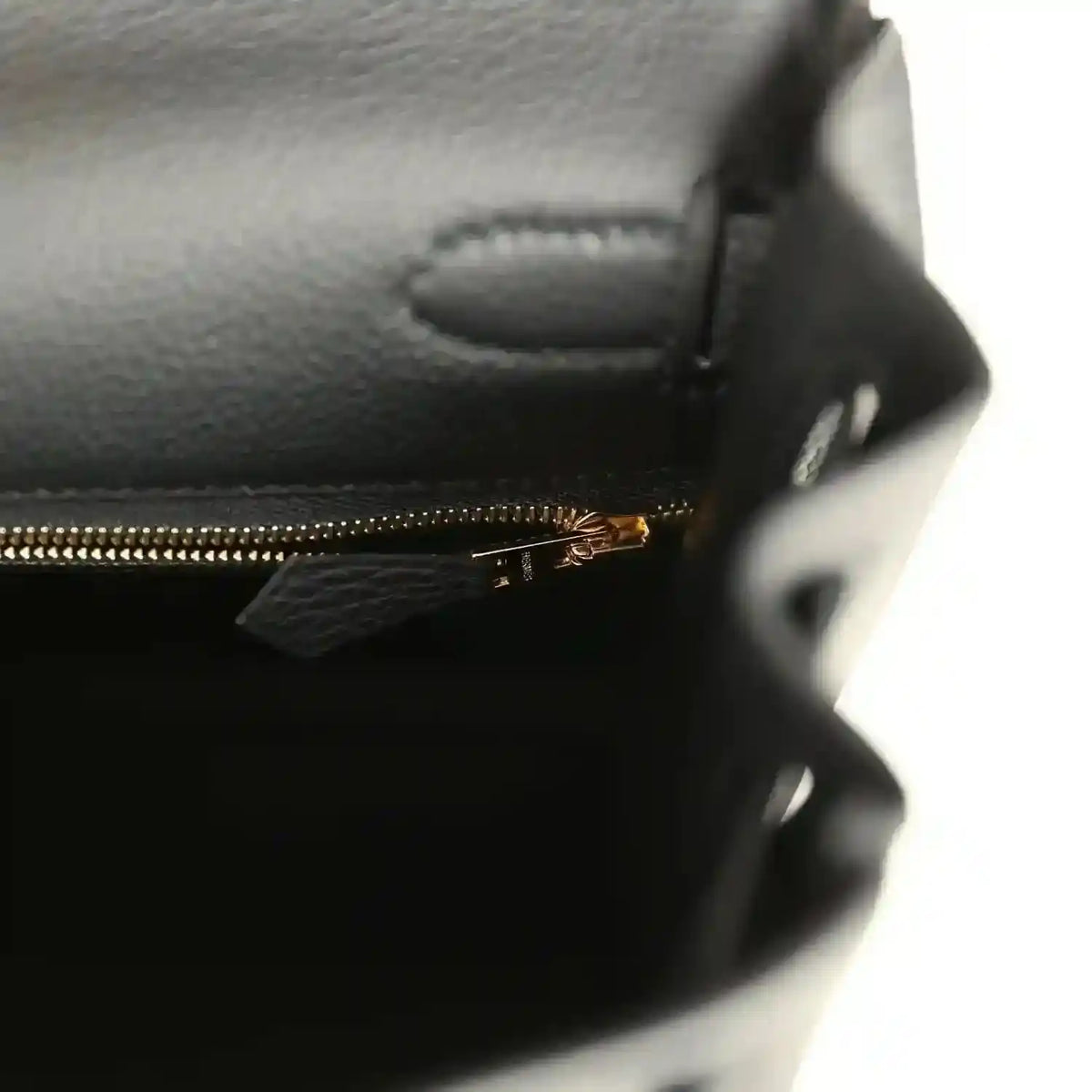 Hermes Kelly Retourne handbag interior pocket with gold zipper and leather stitching