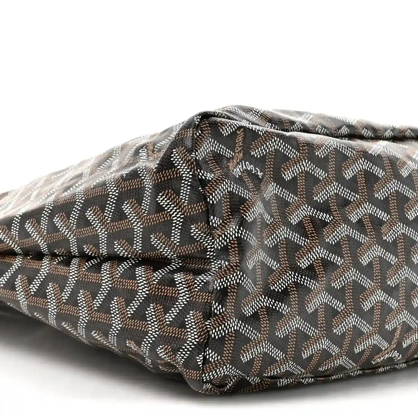 Hobo bag in black and gold canvas with repeating pattern and top fold