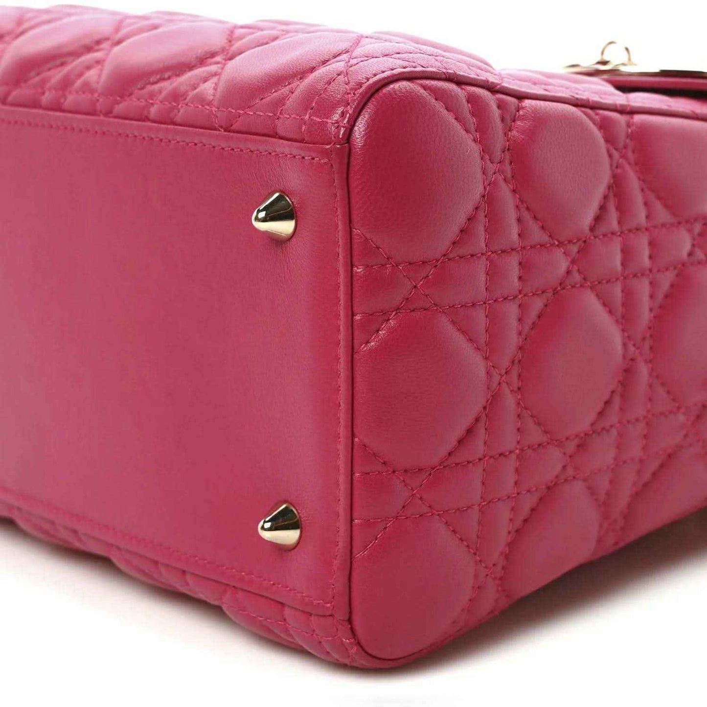 Fuchsia quilted leather handbag with gold-tone corner studs and back panel