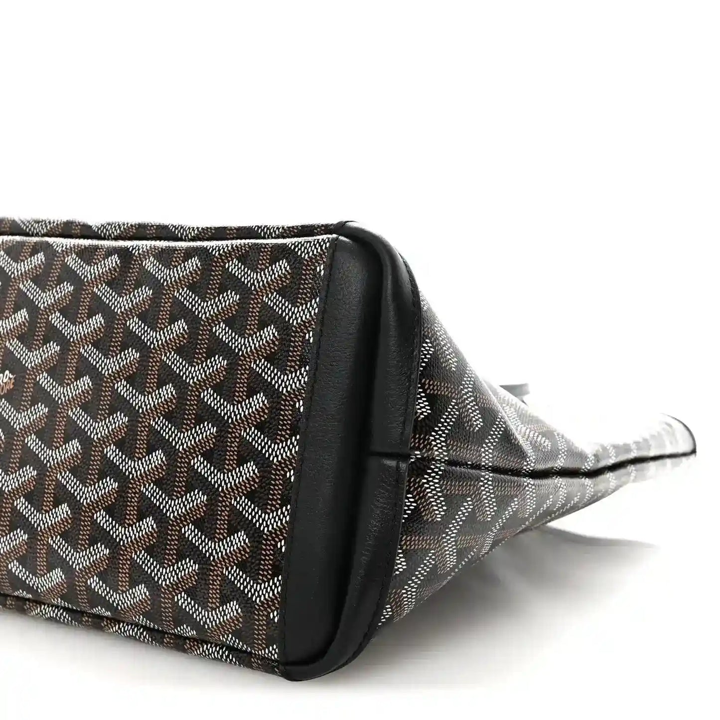 Goyardine tote bag corner with black leather side panel and patterned canvas.