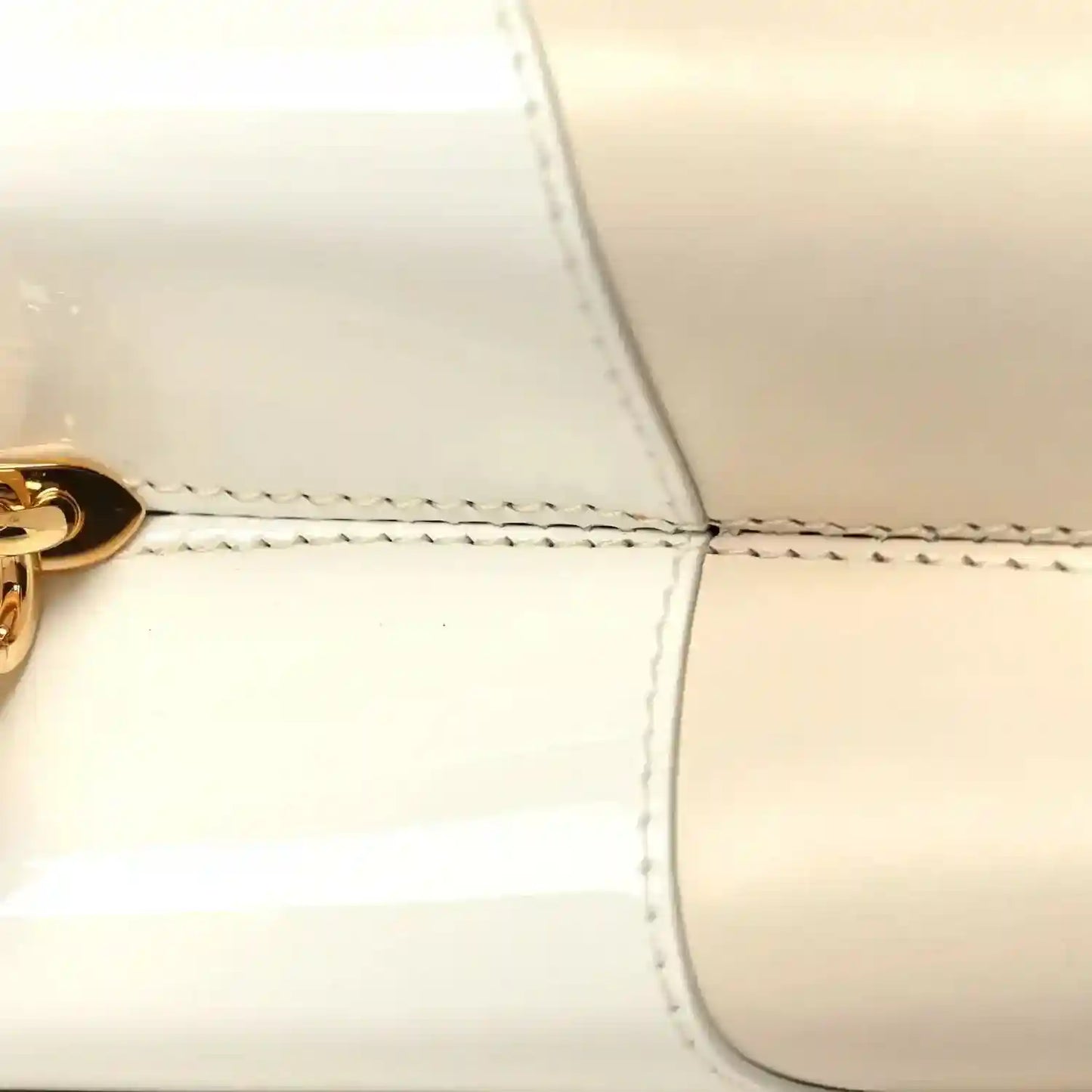 Louis Vuitton beige leather handbag front seam and curved top edge stitching