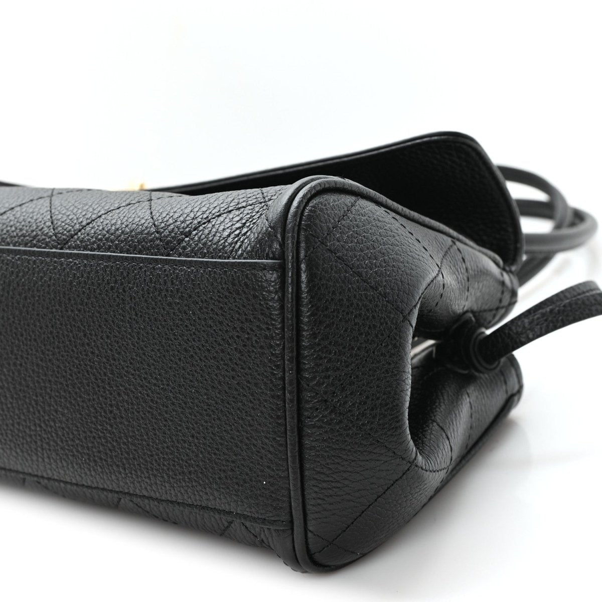 Black grained calfskin shopping bag side view with strap ring and gathered seam