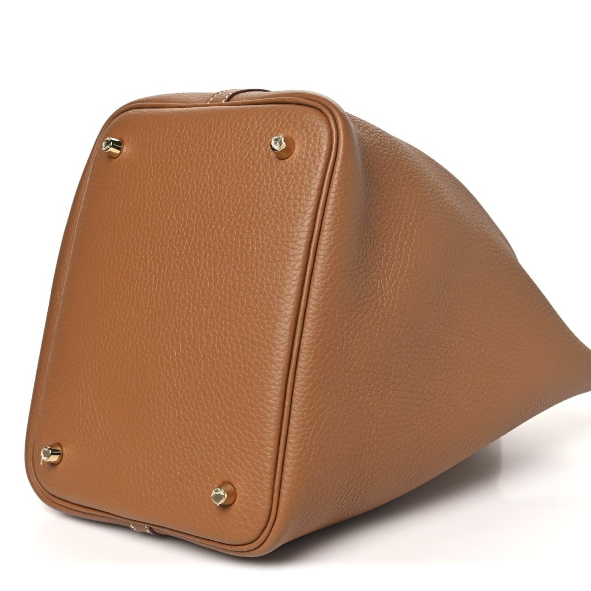 Calfskin leather tote with top handles, corner studs, and gold hardware lock, 3/4 view