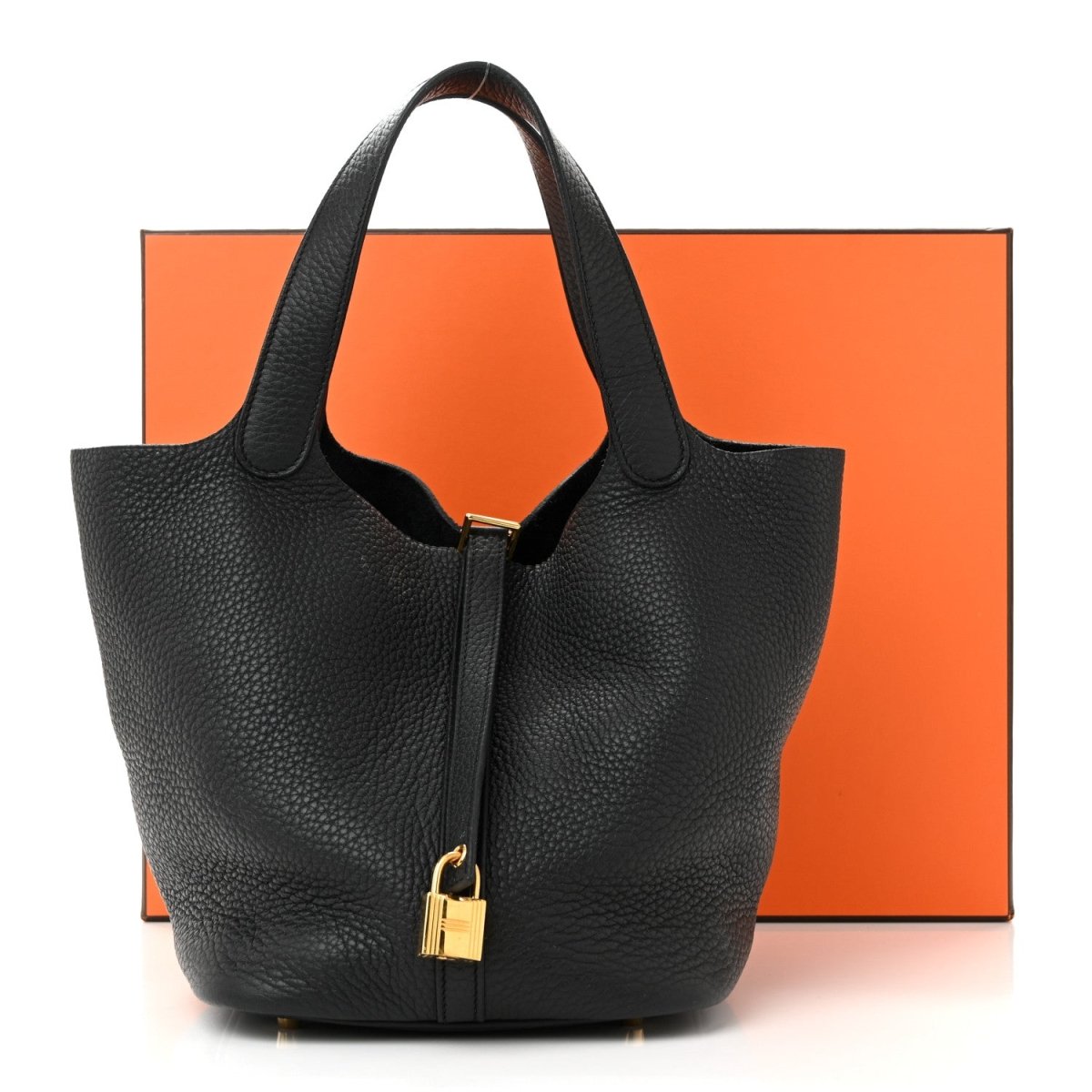 Black leather tote handbag with two handles and front turn-lock clasp