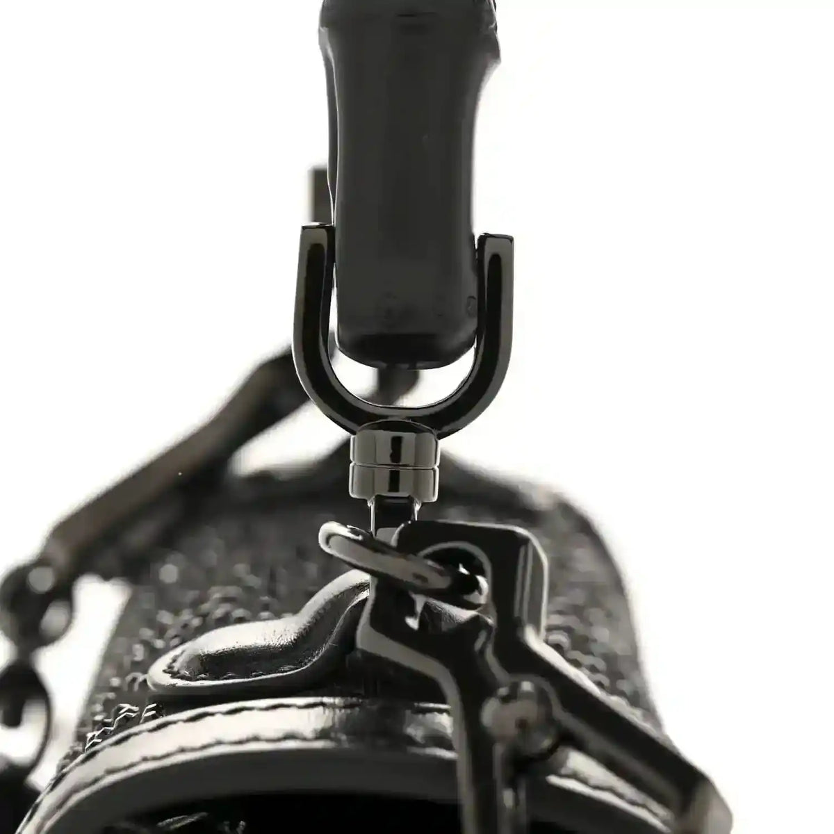 Black mini bag top handle with metal hardware and textured fabric